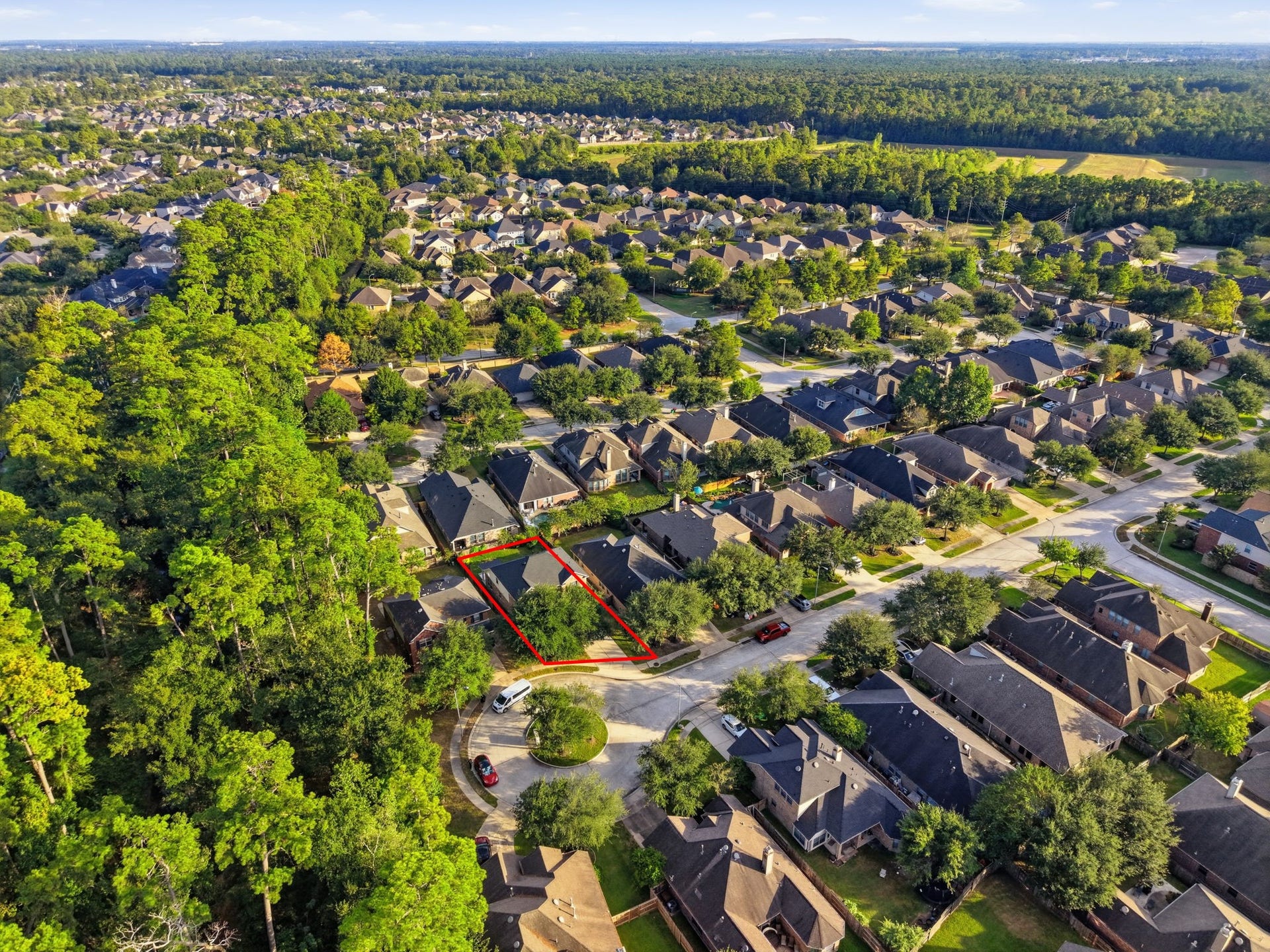 A landscaped island adds character to the street, while neighborhood sidewalks invite leisurely walks through the community.