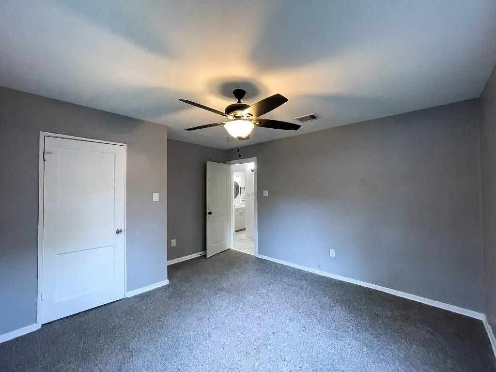 Bright Bedroom with Ceiling Fan and Carpet Flooring