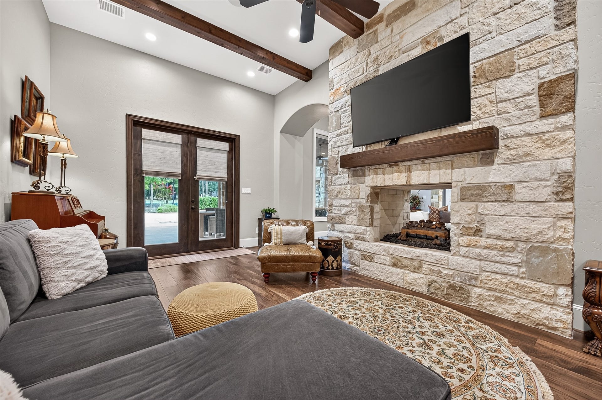 28723 Post Oak Run, Magnolia, TX 77355 Hearth room with french doors leading to patio and pool.