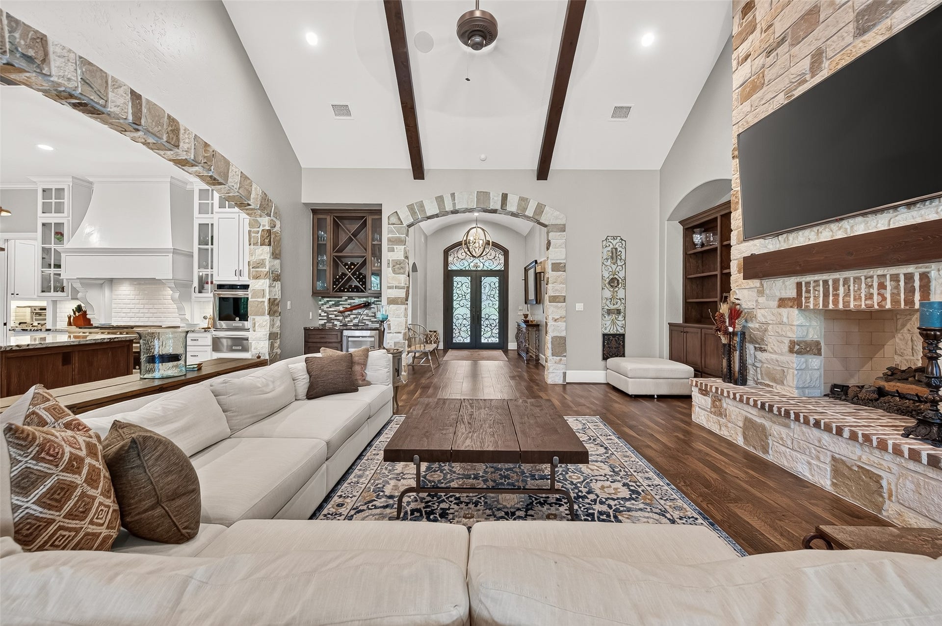 28723 Post Oak Run, Magnolia, TX 77355 Spacious family room with double sided fireplace.