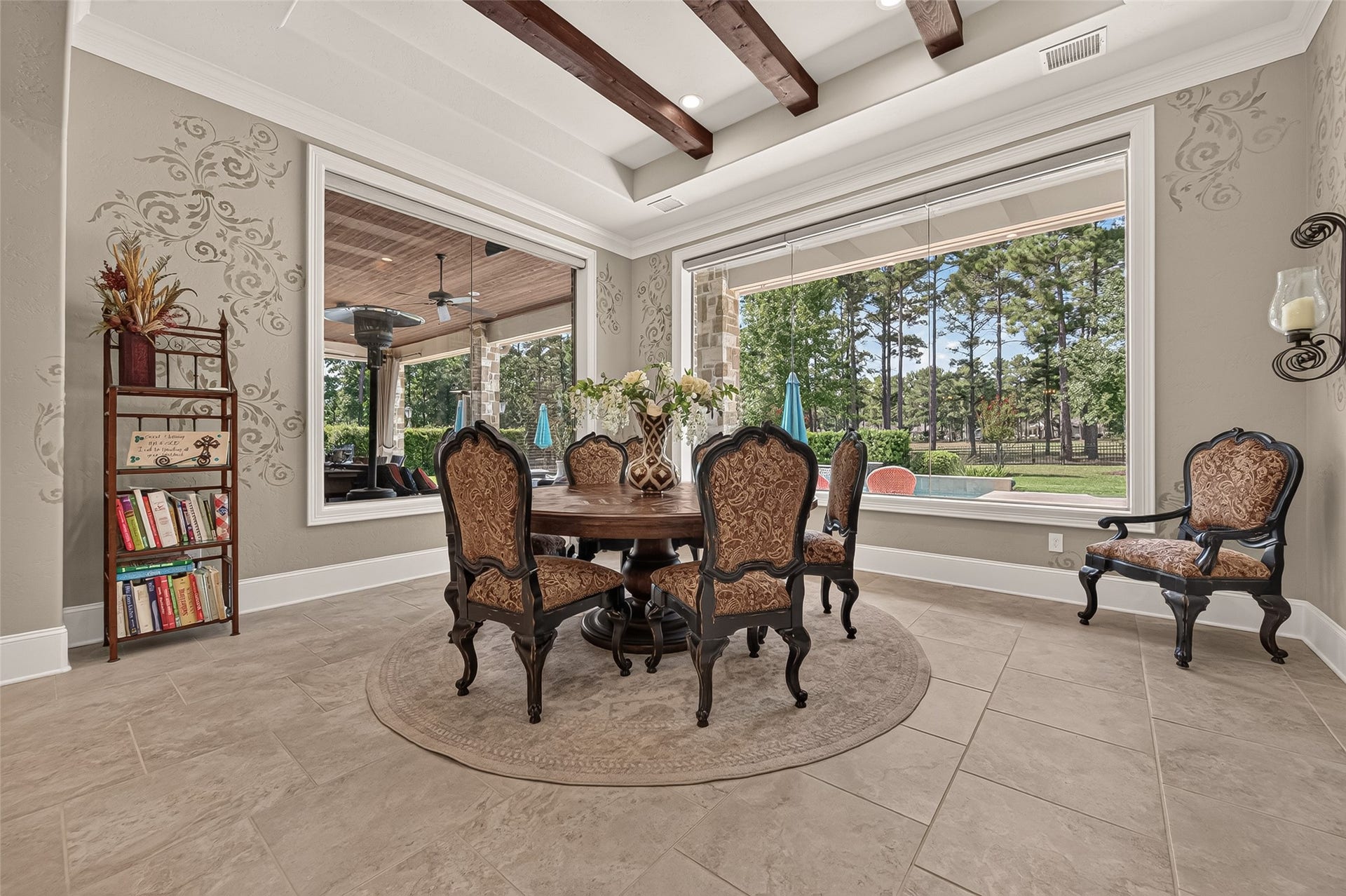 28723 Post Oak Run, Magnolia, TX 77355 Dining room with oversized windows over looking covered patio and pool.