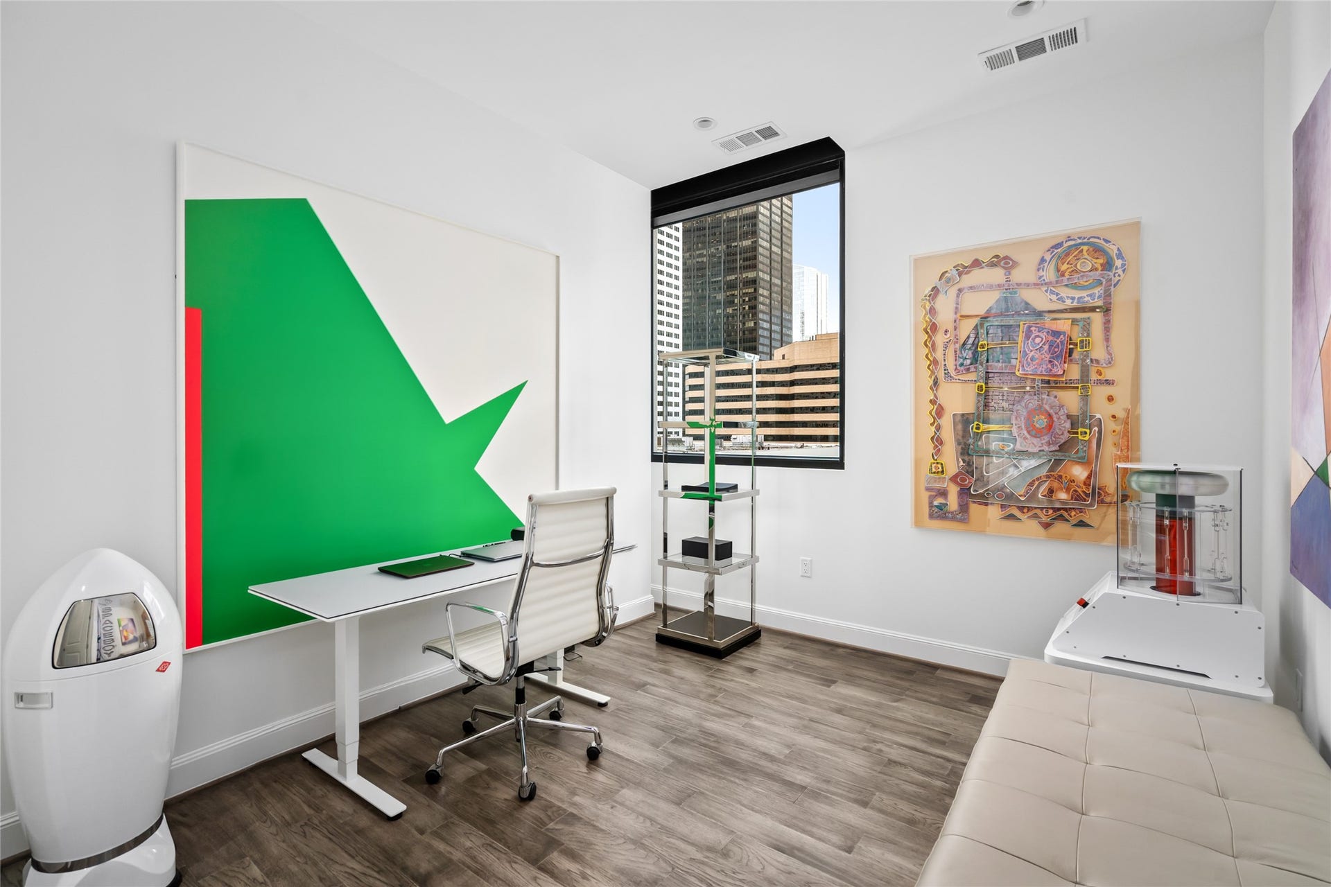 [Secondary Bedroom] Currently utilized as a home office.   The perfect amount of light, and great wall space for artwork or book shelves
