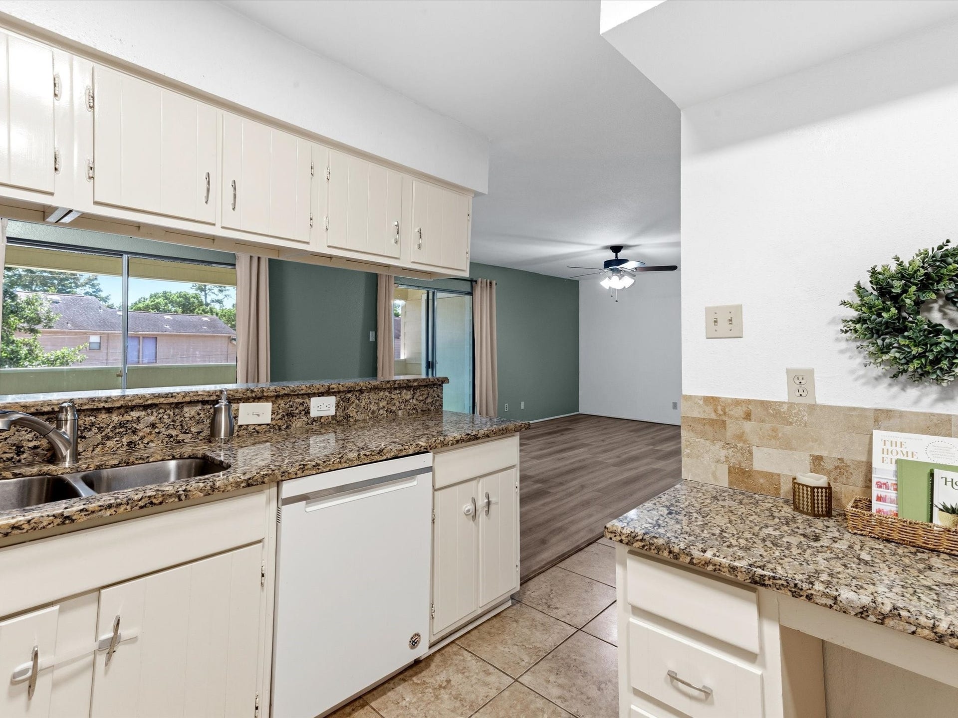 Kitchen view showcasing the natural light and ample storage throughout.