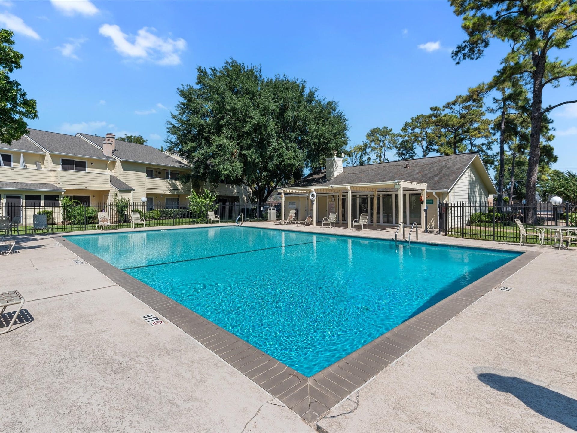 Another view of the community pool with plenty of space to relax and unwind.