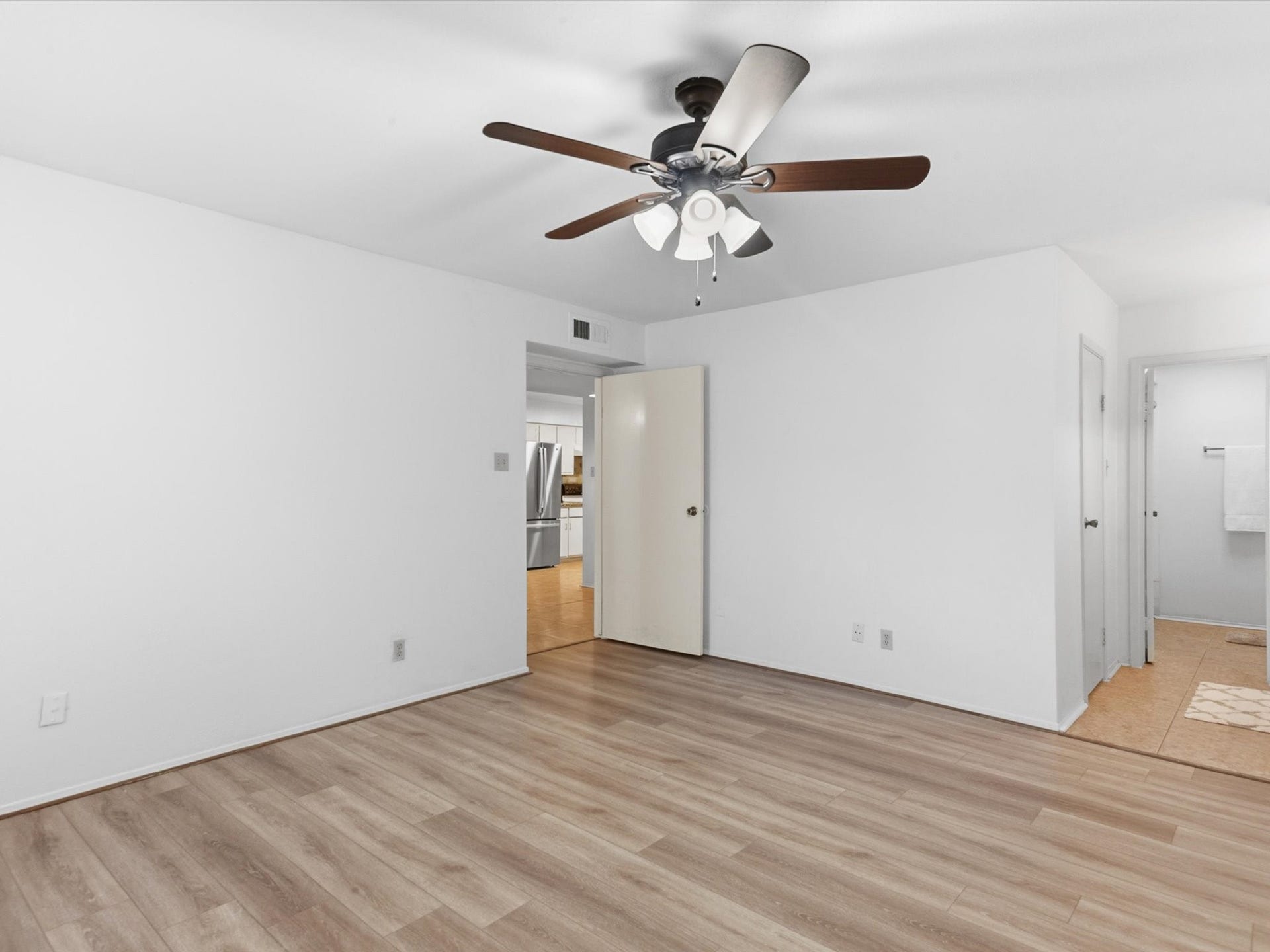 Another angle of the bedroom, highlighting its generous space and flexible layout.