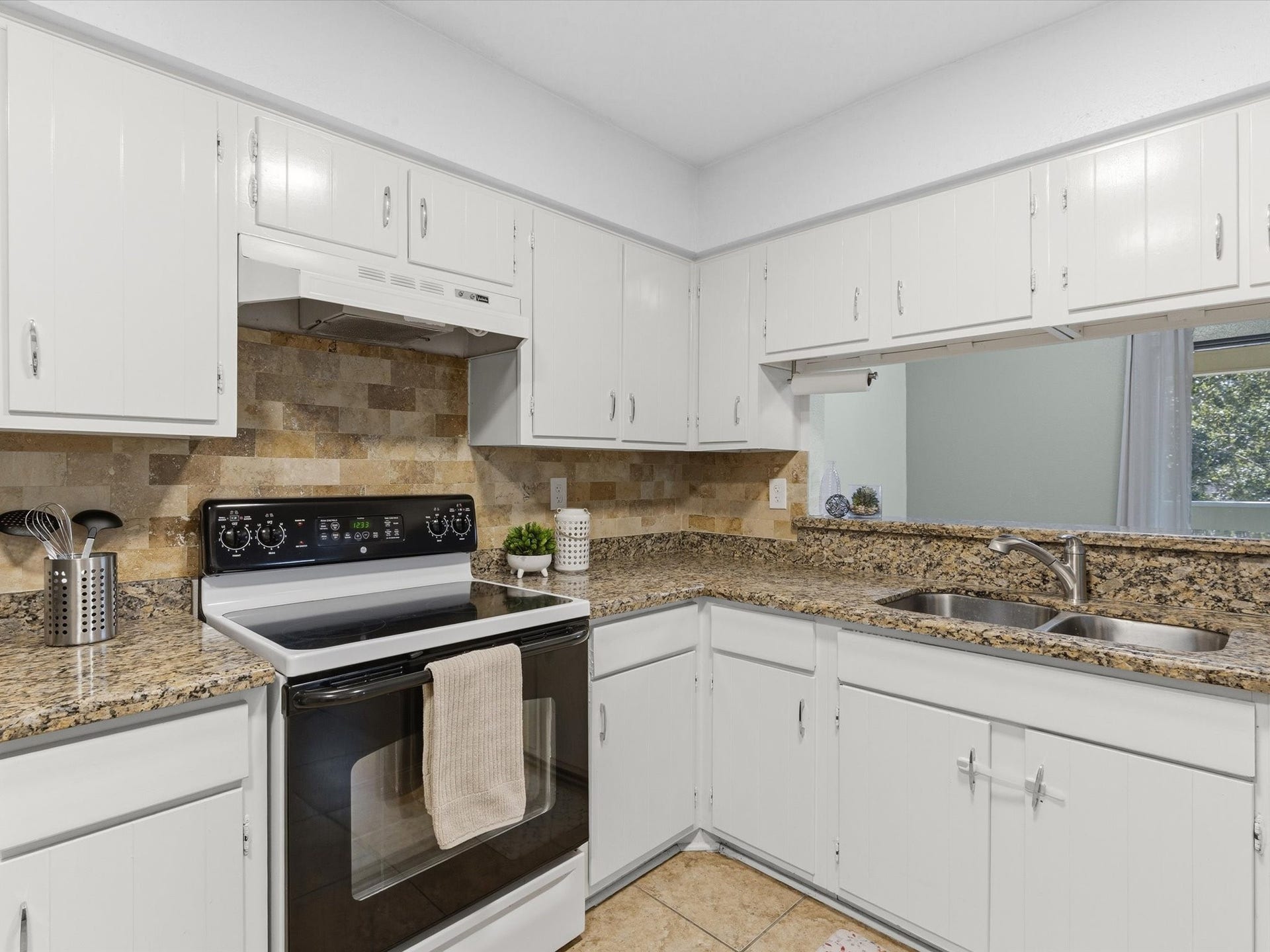 Spacious kitchen with a functional layout and plenty of room for meal preparation.