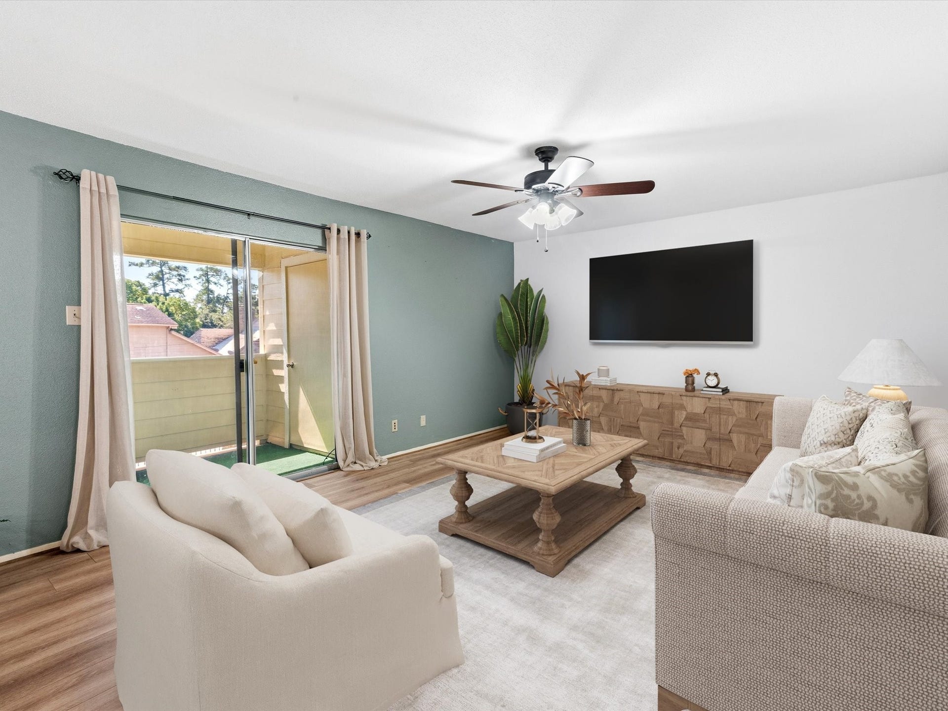 Virtually staged living room showcasing a welcoming layout with natural light from the sliding glass doors.