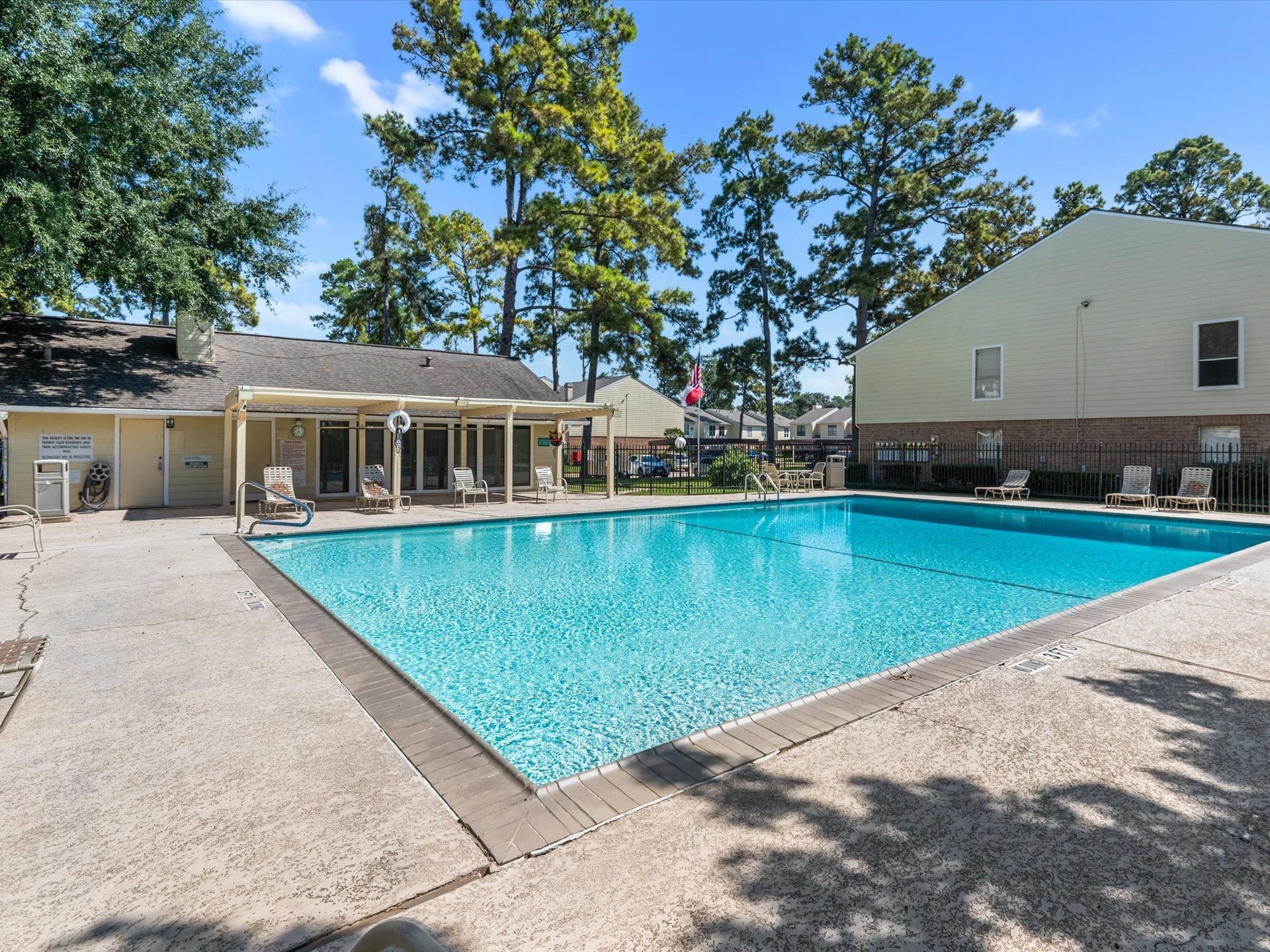 Spacious community swimming pool, perfect for enjoying sunny days.