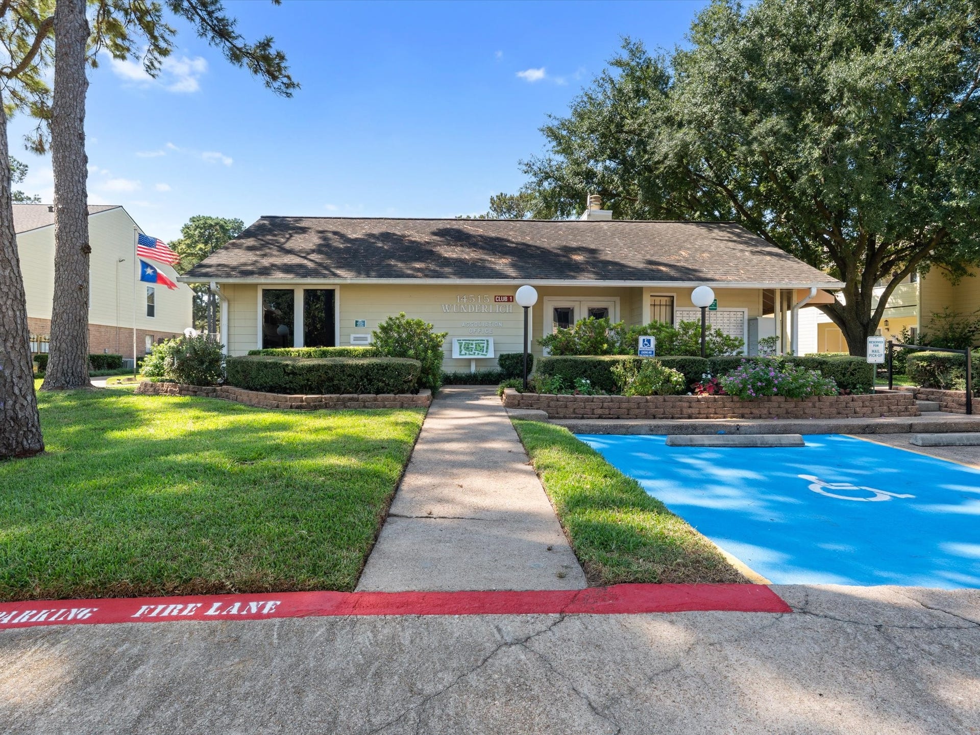 Community amenities surrounded by green space and mature trees.