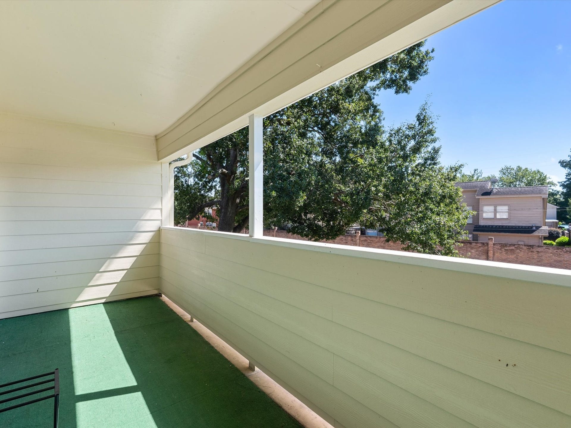 Another angle of the balcony, highlighting the outdoor space and peaceful views.