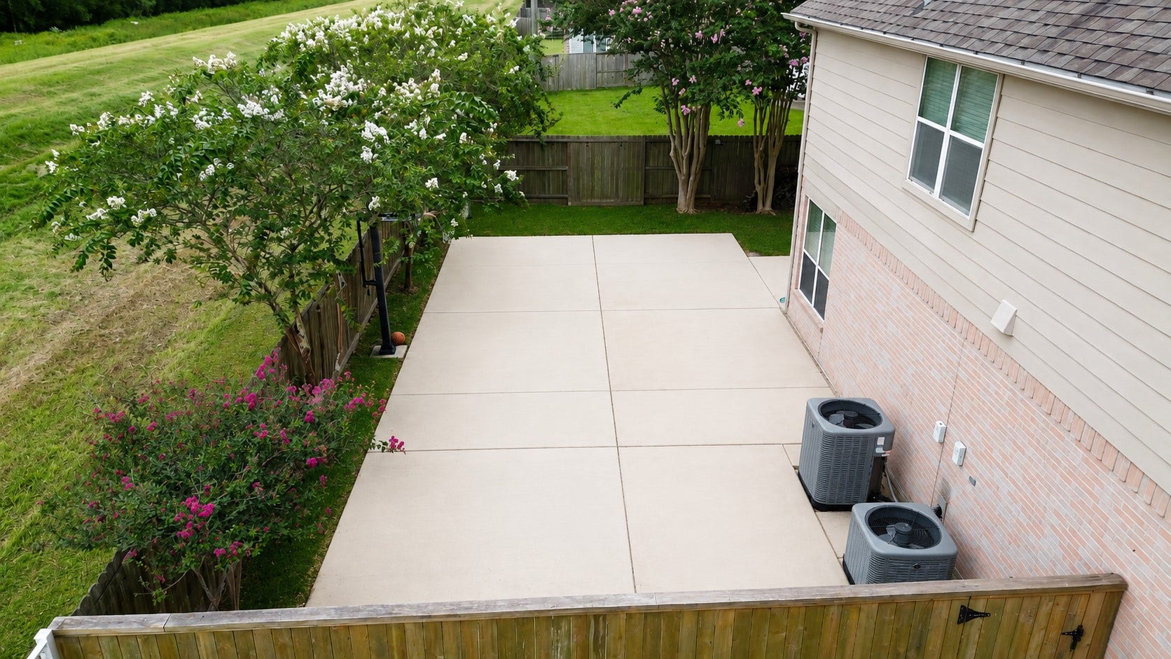 8126 BUFFALO SPRINGS COURT, Sugar Land, TX 77479 EXPANSIVE BACKYARD FEATURES A LARGE CONCRETE PATIO/SPORT AREA, MATURE TREES, AND DIRECT PROXIMITY TO OPEN LEVEE GREENSPACE.