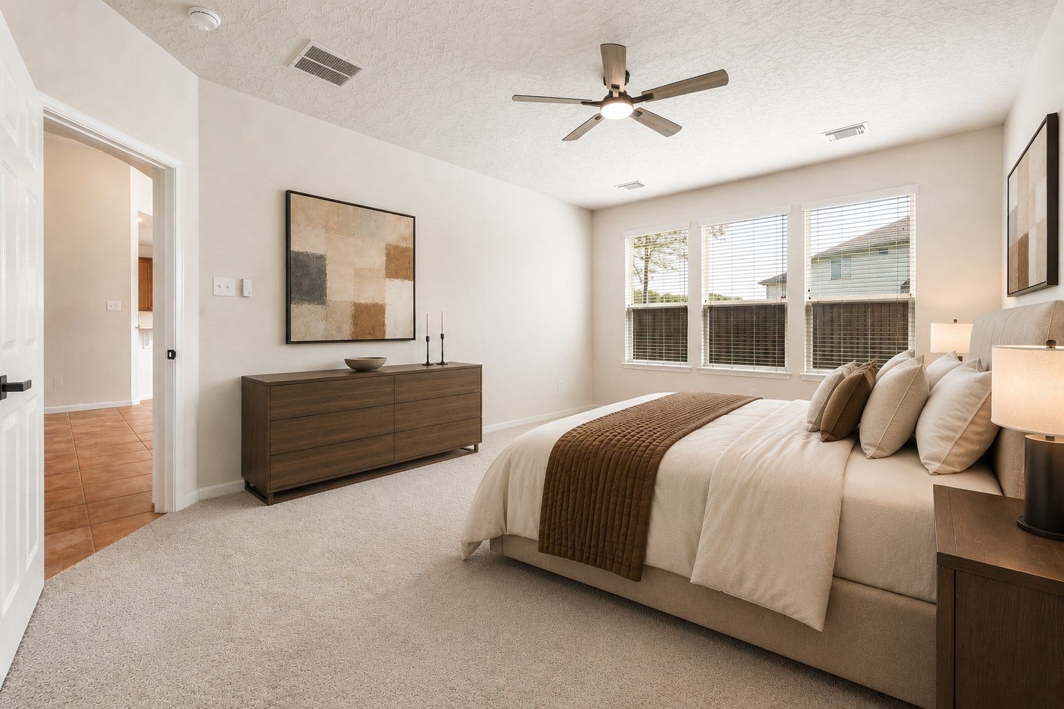 8126 BUFFALO SPRINGS COURT, Sugar Land, TX 77479 SPACIOUS PRIMARY BEDROOM WITH THREE LARGE WINDOWS, HIGH CEILINGS, AND ABUNDANT NATURAL LIGHT. *Virtually staged.