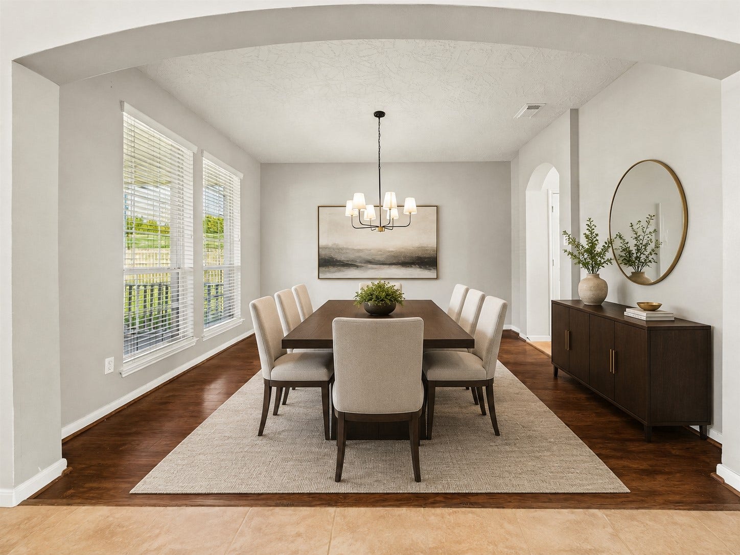 8126 BUFFALO SPRINGS COURT, Sugar Land, TX 77479 SPACIOUS FORMAL DINING ROOM WITH RICH WOOD FLOORING, OVERSIZED WINDOWS, AND AN ELEGANT ARCHED OPENING. THE GENEROUS DIMENSIONS PROVIDE PLENTY OF ROOM FOR LARGE-SCALE ENTERTAINING. *Virtually staged.
