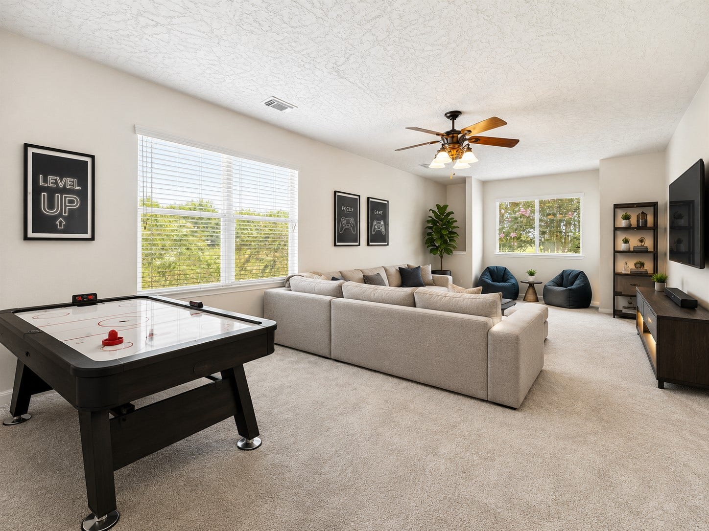 8126 BUFFALO SPRINGS COURT, Sugar Land, TX 77479 EXPANSIVE UPSTAIRS GAME ROOM WITH MULTIPLE WINDOWS, GENEROUS WALL SPACE, AND ROOM FOR SEVERAL ENTERTAINMENT ZONES. *Virtually staged.
