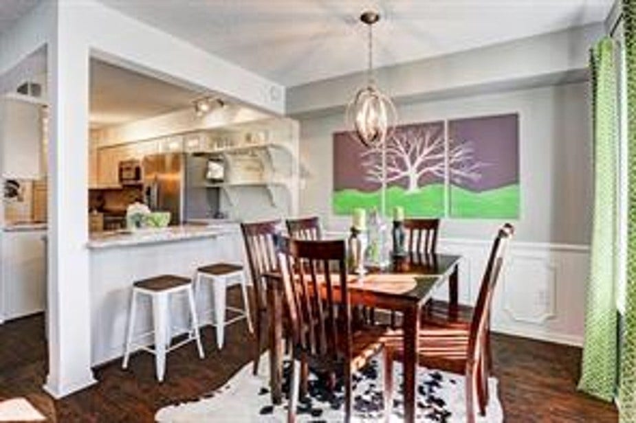 351 N Post Oak Lane, #715, Houston, TX 77024 Bright dining area with decorative light fixture. Large window for natural light.