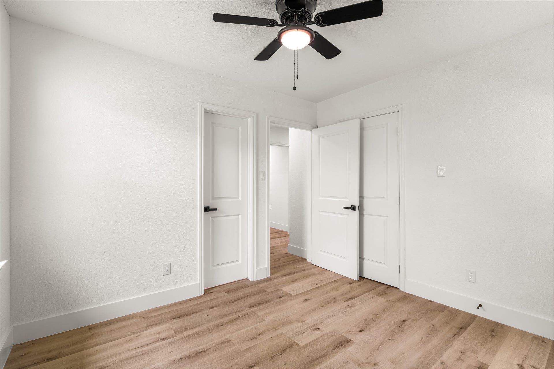 3048 Briarwick Lane, Houston, TX 77093 Bright and inviting bedroom featuring generous closet space, abundant natural light, and a soothing neutral palette.
