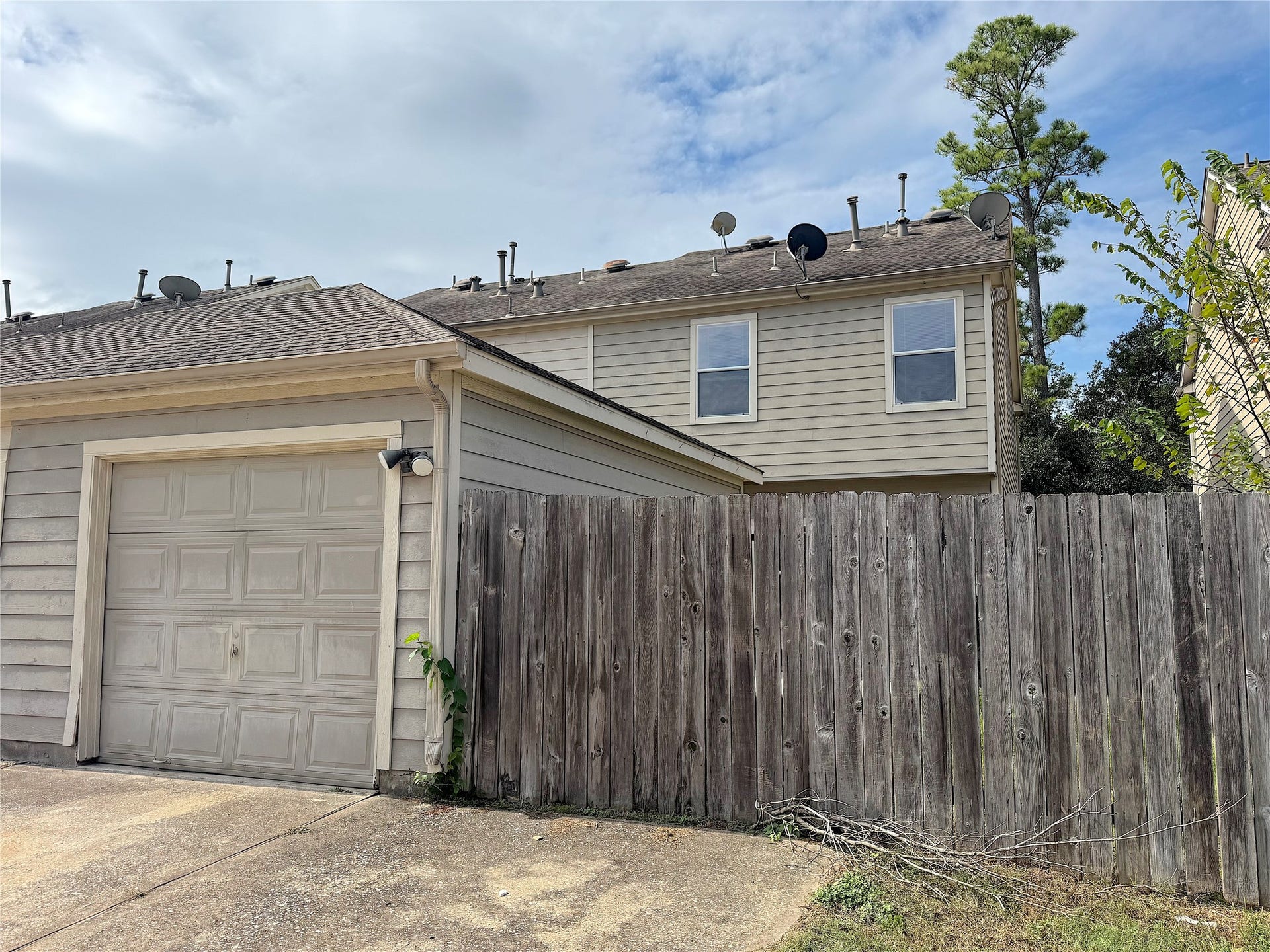 23822 Single Oak Street, Spring, TX 77373 View from Alleyway behind home with garage entrance.