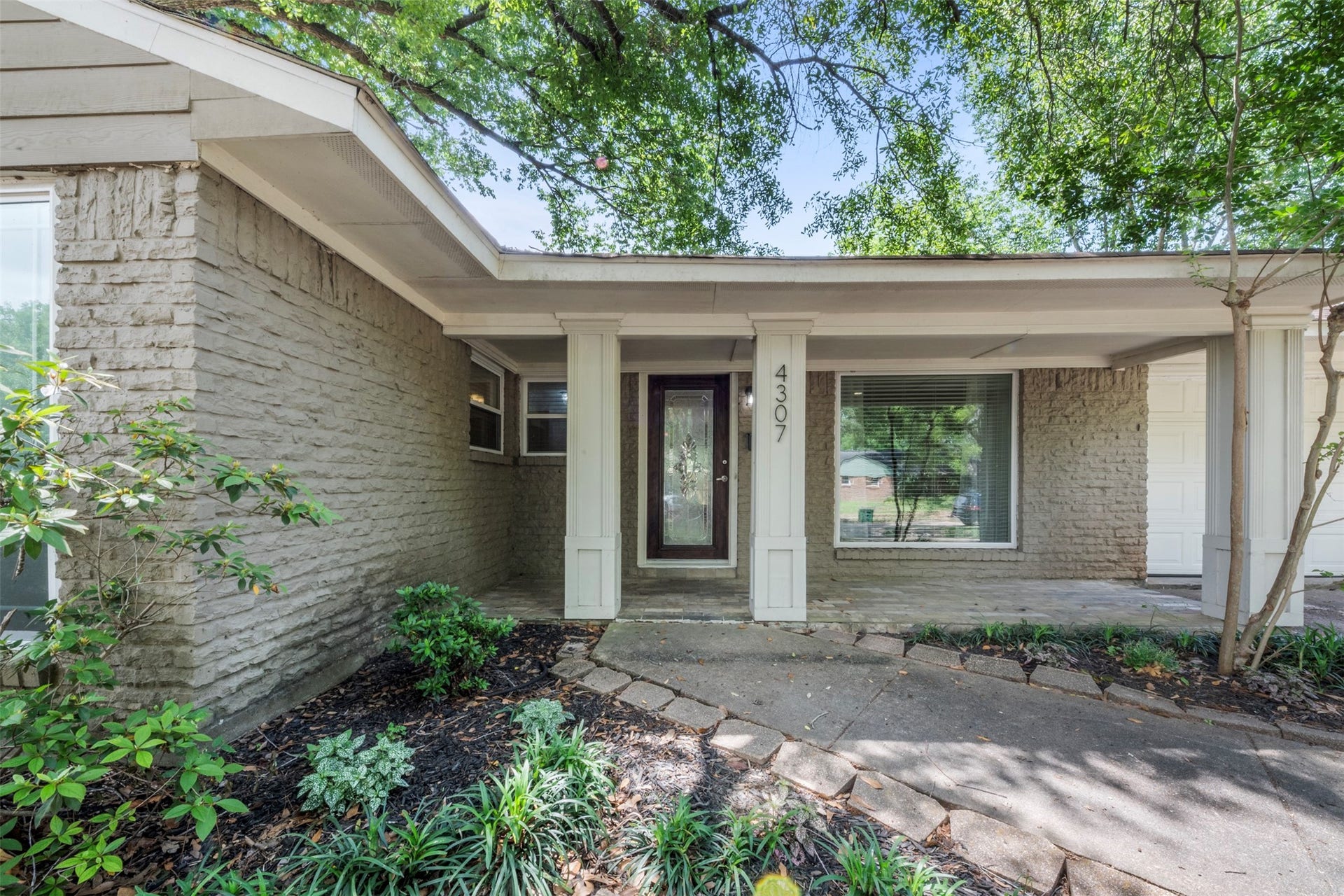 Welcome to 4307 Spellman. Add some rocking chairs or a swing and enjoy your morning coffee under the porch.