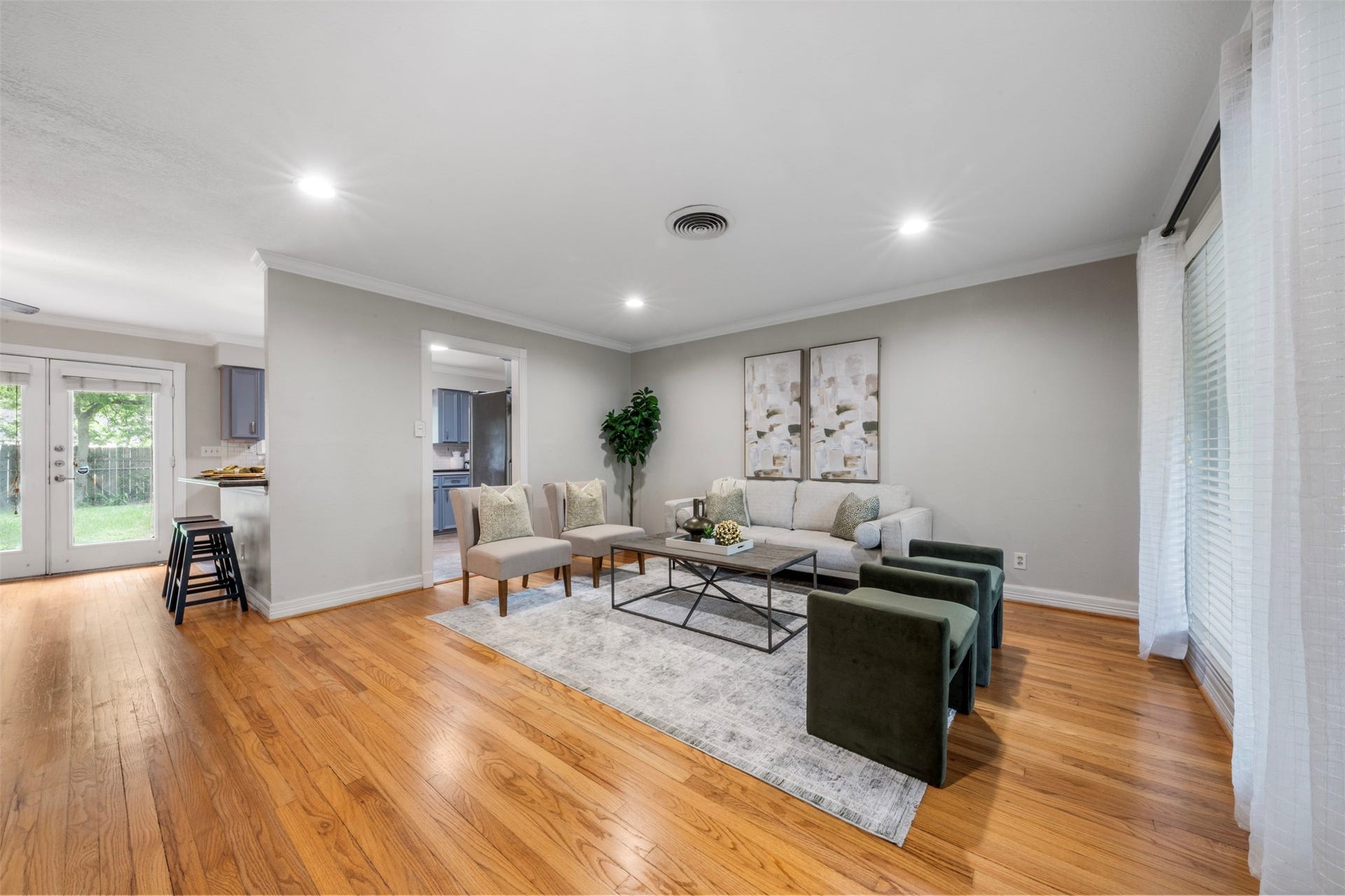 Newly refinished original hardwood floors flow seamlessly through the home with character and charm.