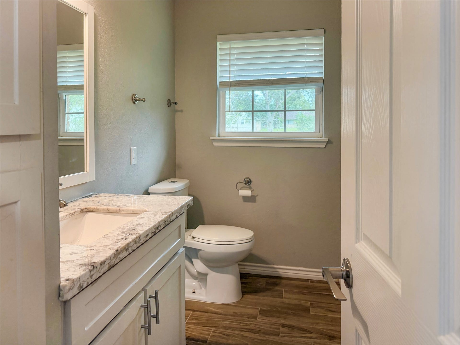 816 W Mulberry, Angleton, TX 77515 Conveniently located half bath just off the living room, providing easy access for guests and everyday use.
