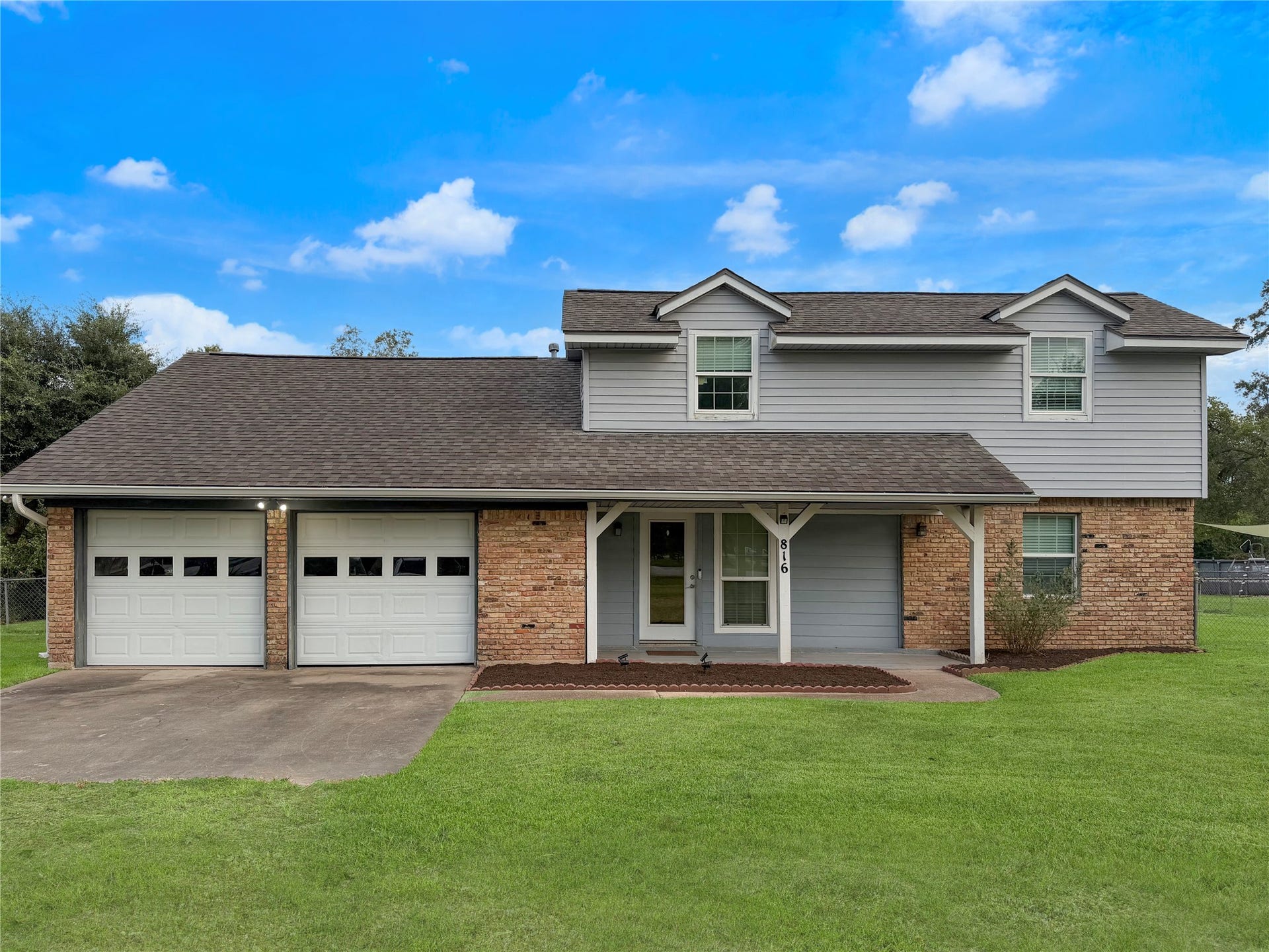 816 W Mulberry, Angleton, TX 77515 Attractive two-story home featuring a welcoming front entrance and classic exterior design. Spacious layout offers two levels of living space with inviting curb appeal.