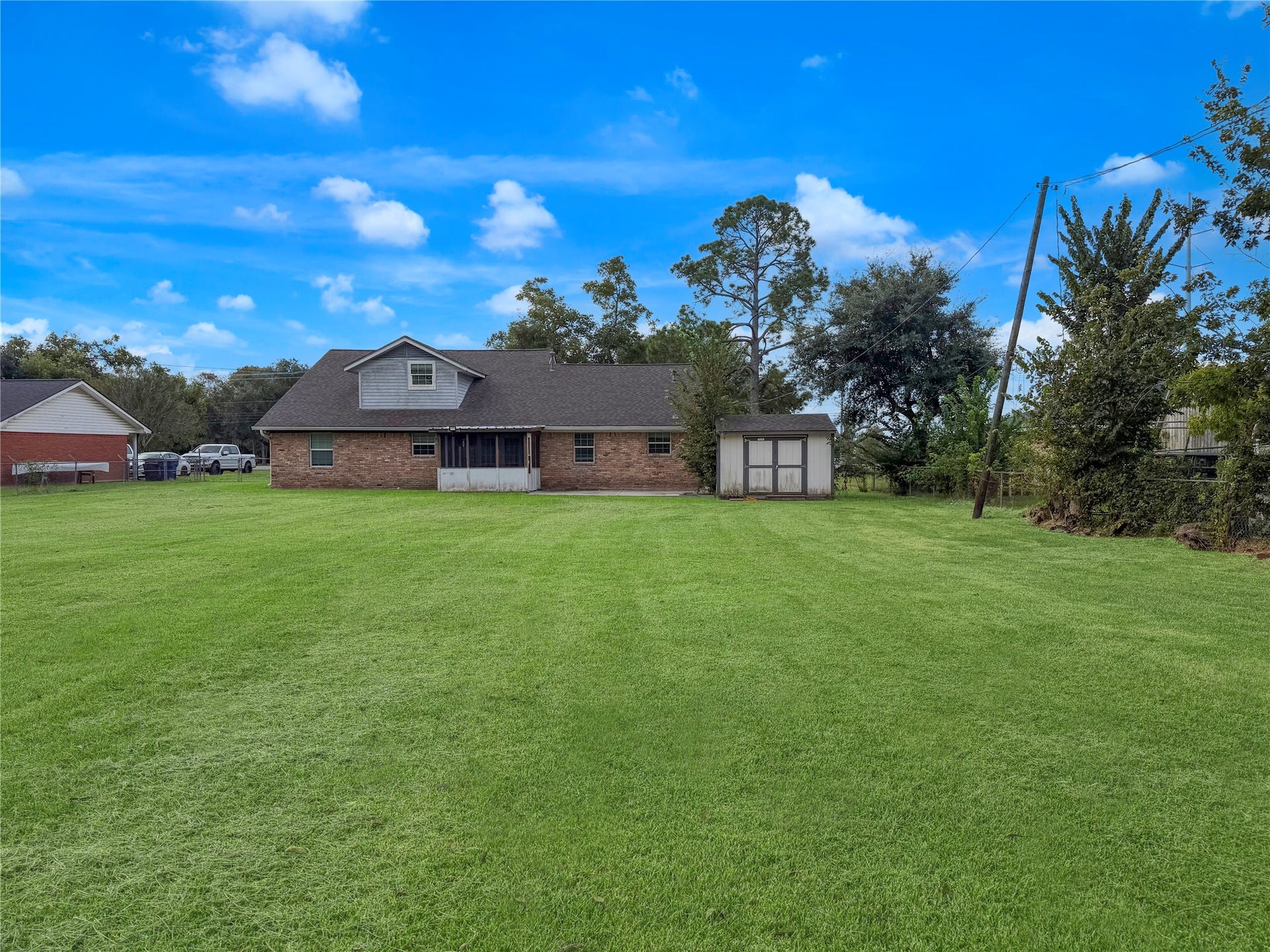816 W Mulberry, Angleton, TX 77515 Spacious backyard offering plenty of room for outdoor activities, entertaining, gardening, or creating your own outdoor retreat.