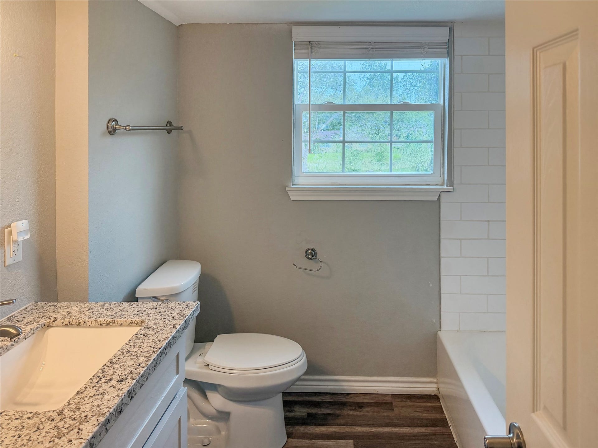 816 W Mulberry, Angleton, TX 77515 Secondary bathroom features white cabinetry, providing convenient storage and a clean, classic look.
