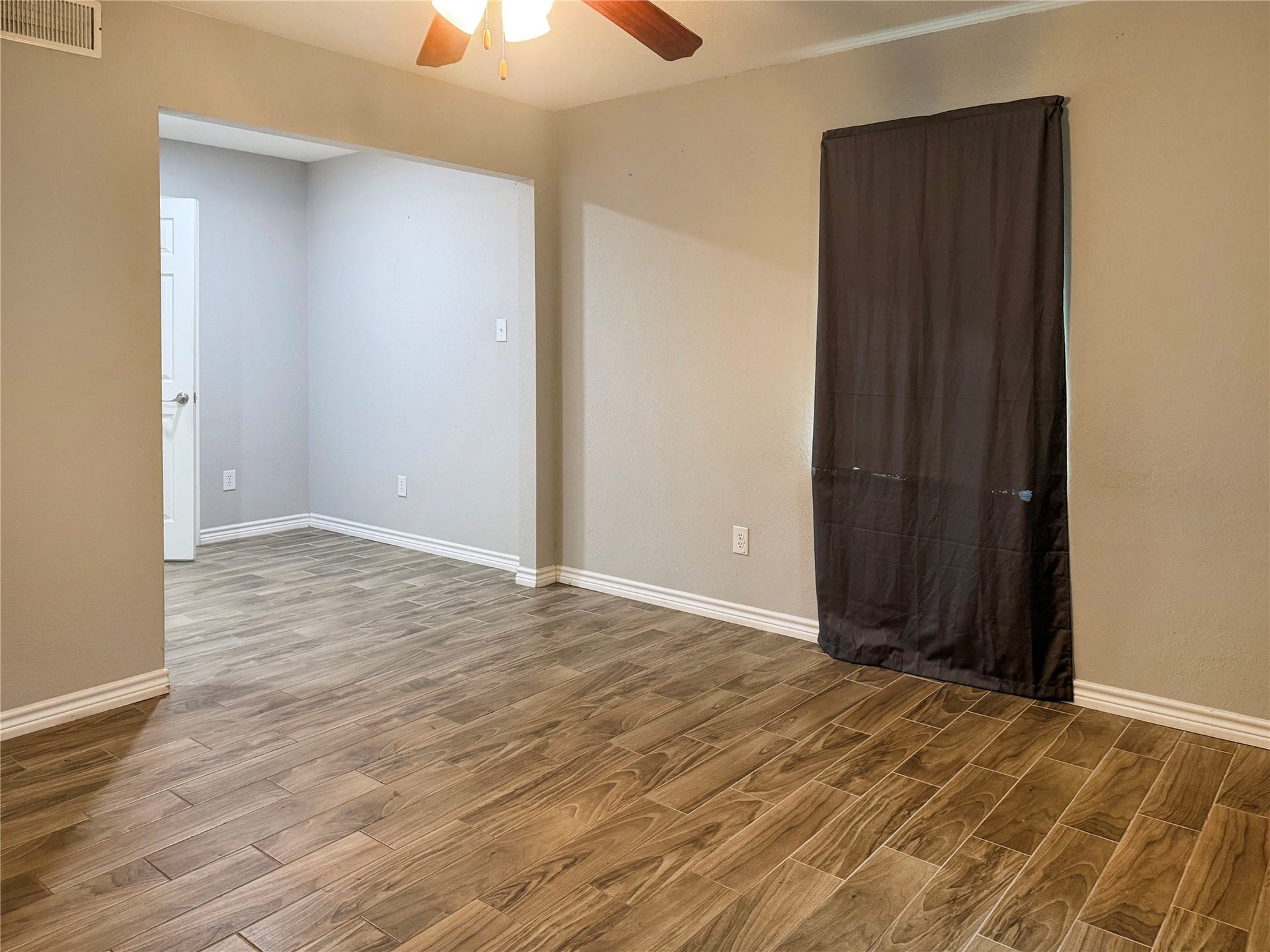 816 W Mulberry, Angleton, TX 77515 Primary bedroom features a cozy sitting area, offering additional space for relaxing, reading, or unwinding.