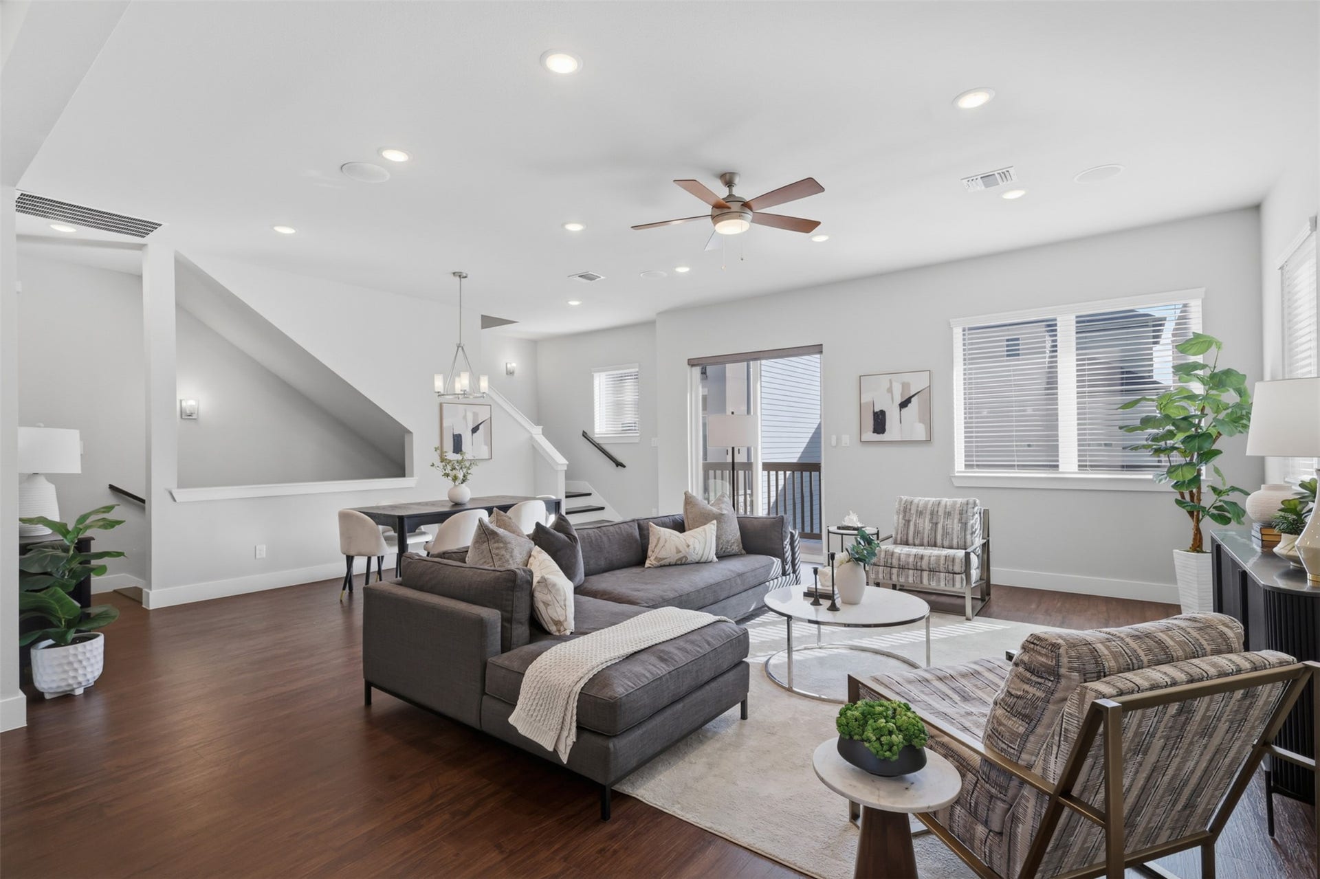1444 W 34th 1/2 Street, Houston, TX 77018 The second floor opens into a bright, expansive living area designed for both everyday comfort and entertaining, with built-in ceiling speakers and abundant natural light.