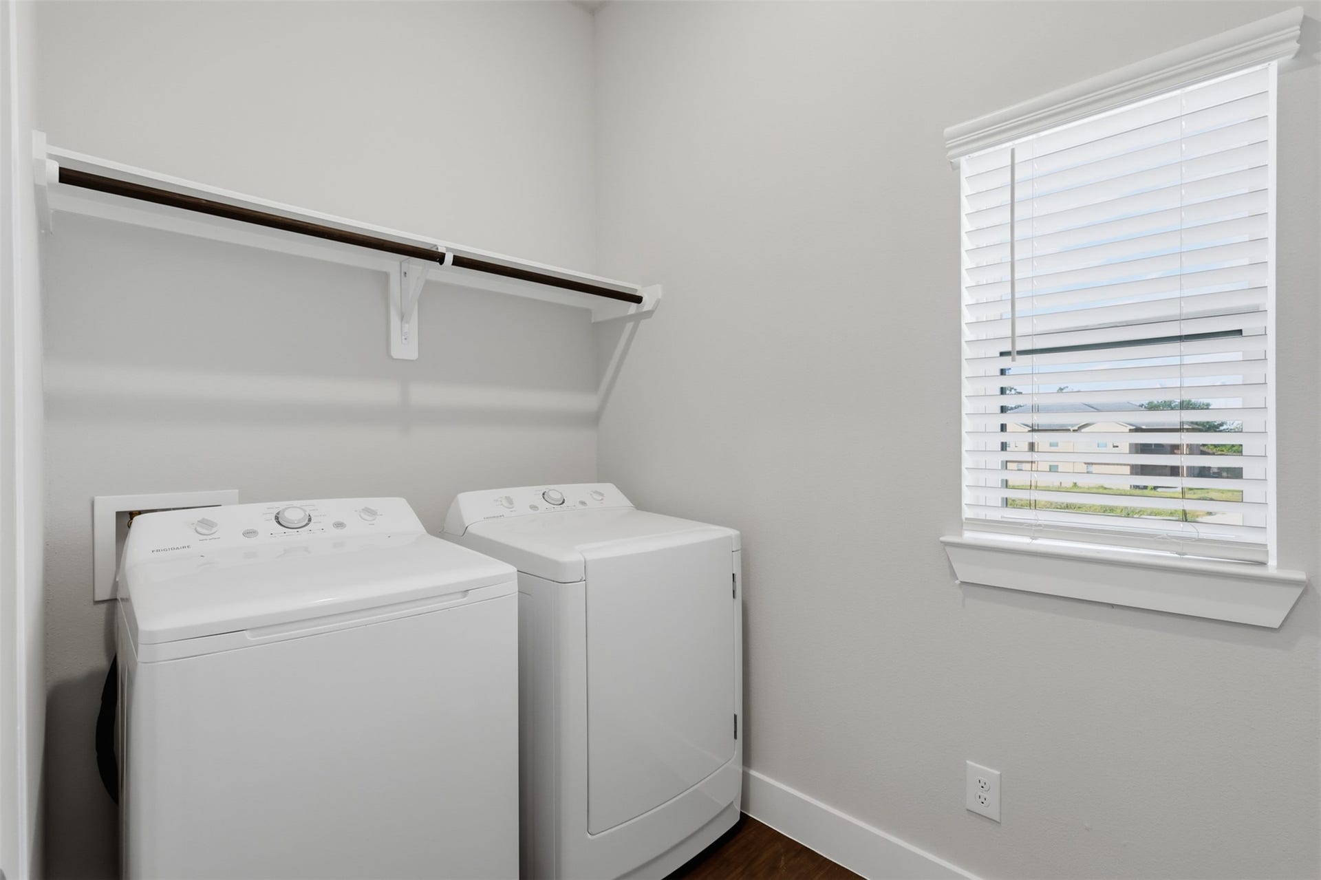 1444 W 34th 1/2 Street, Houston, TX 77018 A dedicated second-floor laundry room adds everyday convenience with built-in shelving and plenty of functional space.