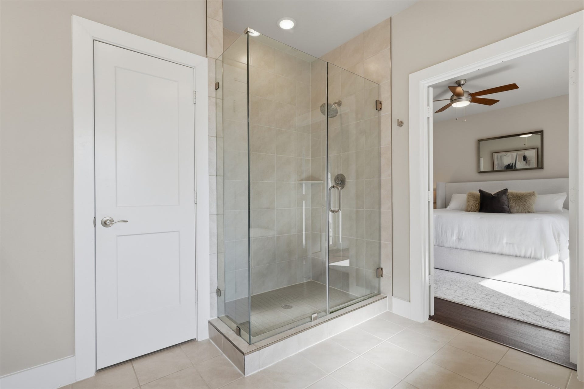 1444 W 34th 1/2 Street, Houston, TX 77018 A spacious frameless glass shower completes the primary bath, offering a clean, modern finish and a seamless connection back to the primary suite.