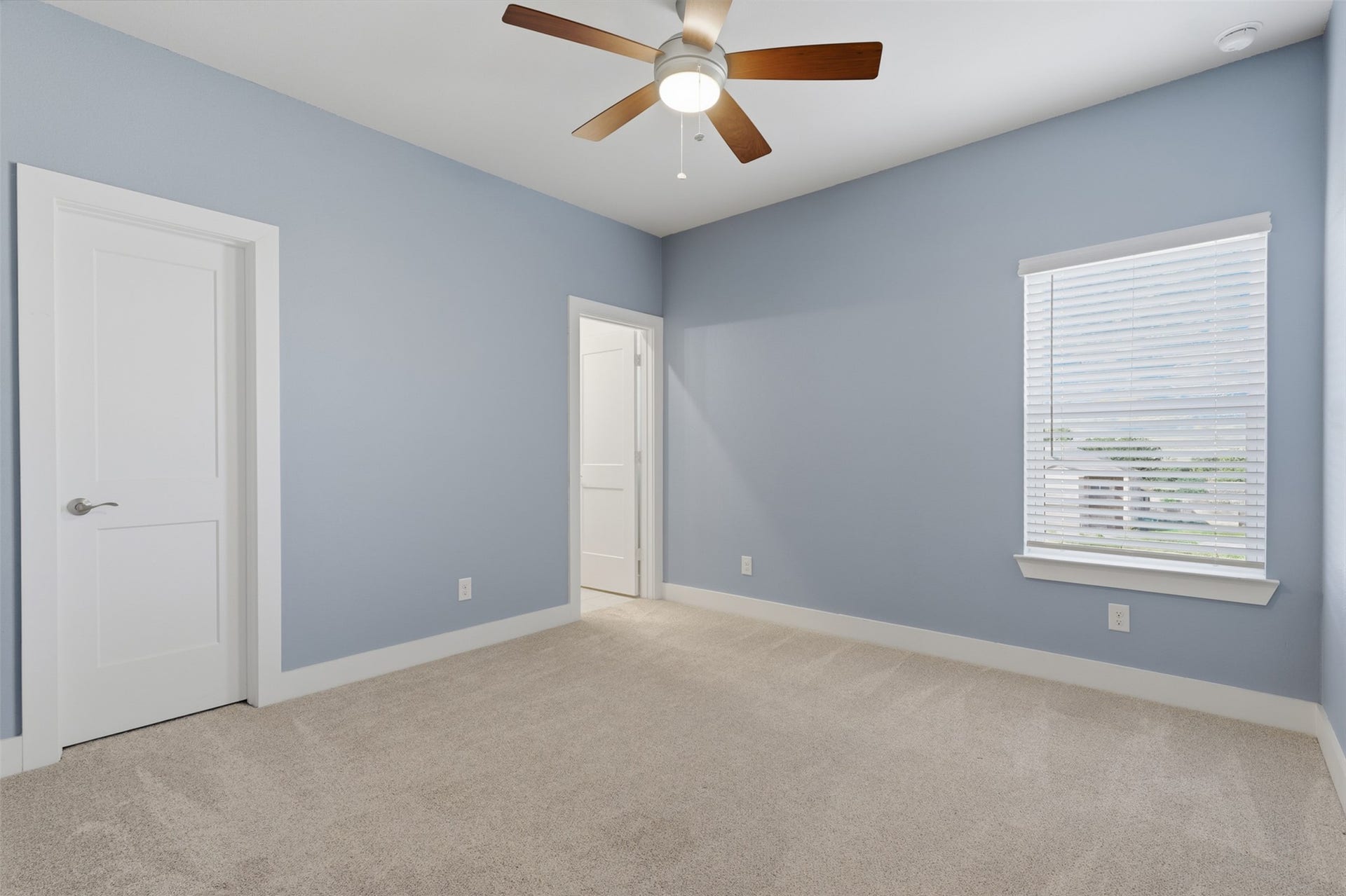 1444 W 34th 1/2 Street, Houston, TX 77018 A spacious third-floor secondary bedroom provides plenty of room for guests, family, or a home office, with a large window bringing in natural light.