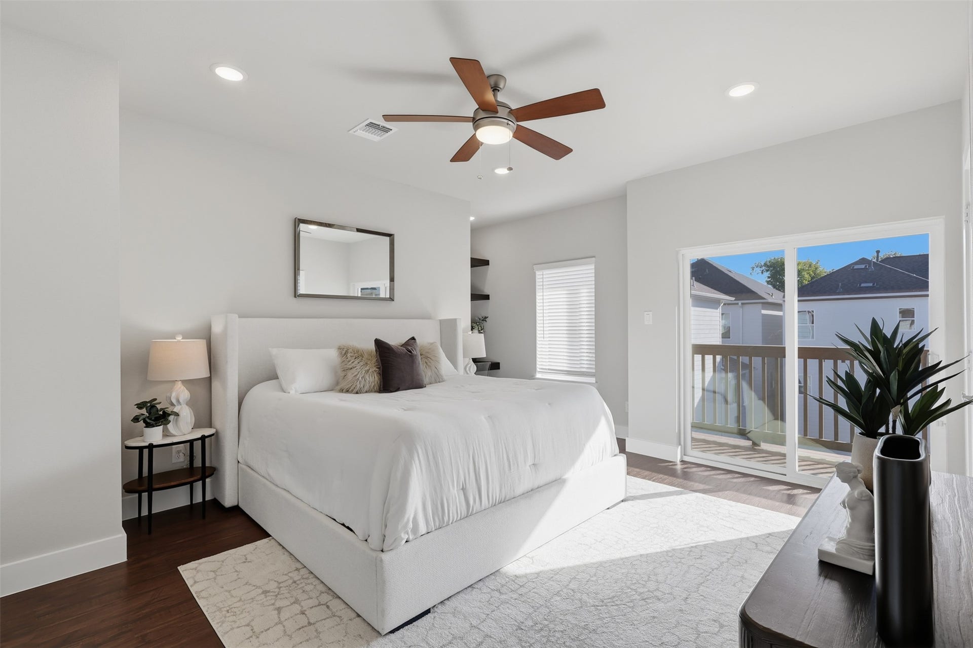 1444 W 34th 1/2 Street, Houston, TX 77018 The third-floor primary suite feels like a private retreat, featuring generous proportions, abundant natural light, and direct access to its own private balcony.