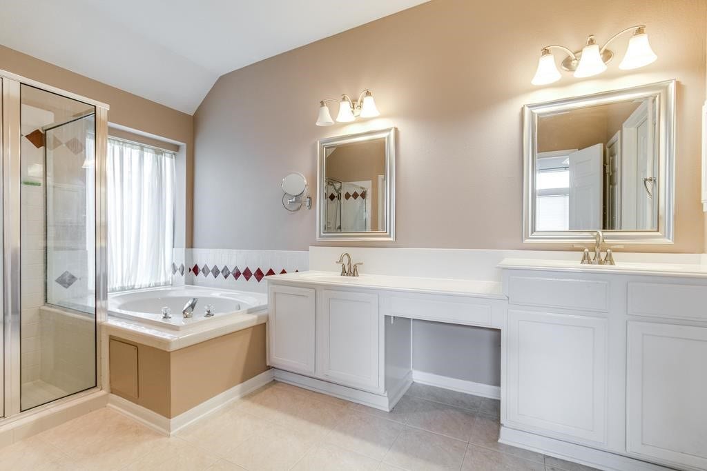 1718 BUMELIA COURT, Sugar Land, TX 77479 STUNNING MASTER
BATHROOM BOASTS DUAL
SINKS; OFFERING PERSONAL
SPACE.