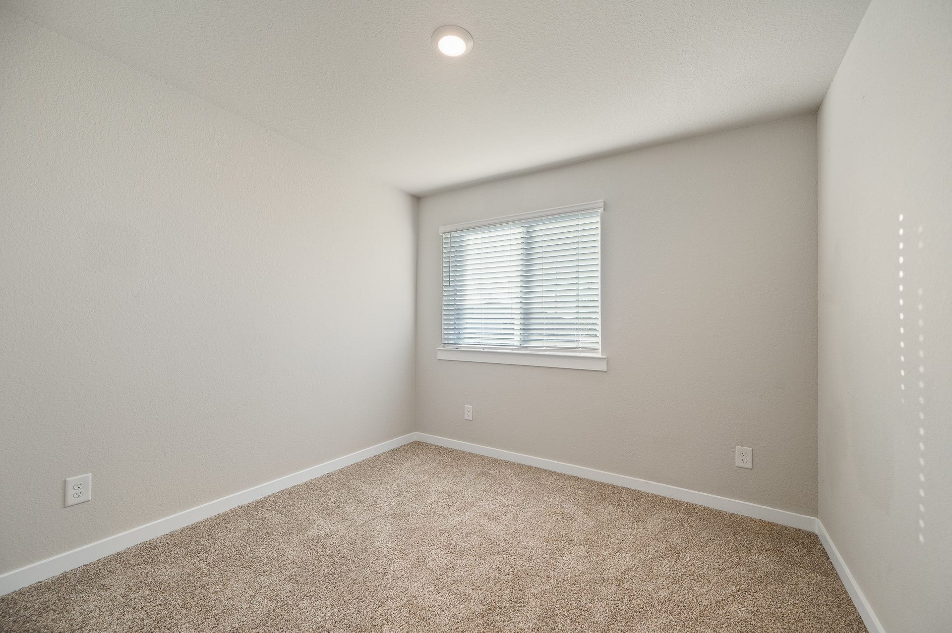 Bedroom #2 is located by the front and can be used as an office space, ideal for those working remotely.