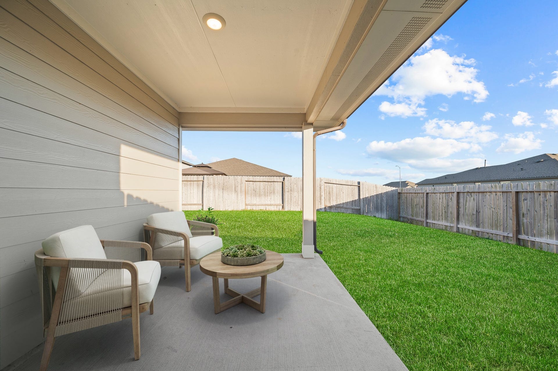 Virtual staging - the inviting and spacious backyard with lush green lawn is ideal for entertaining or relaxing after work.