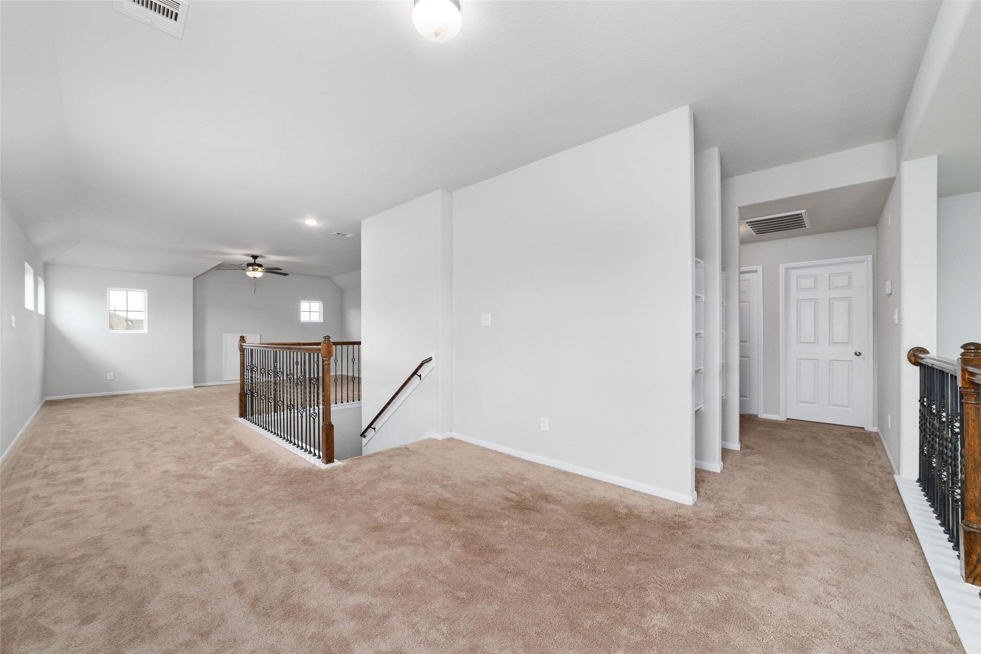 20755 Beeston Glade Lane, Katy, TX 77449 Another view of the gameroom and landing area upstairs. Check out the additional shelving in the hallway!