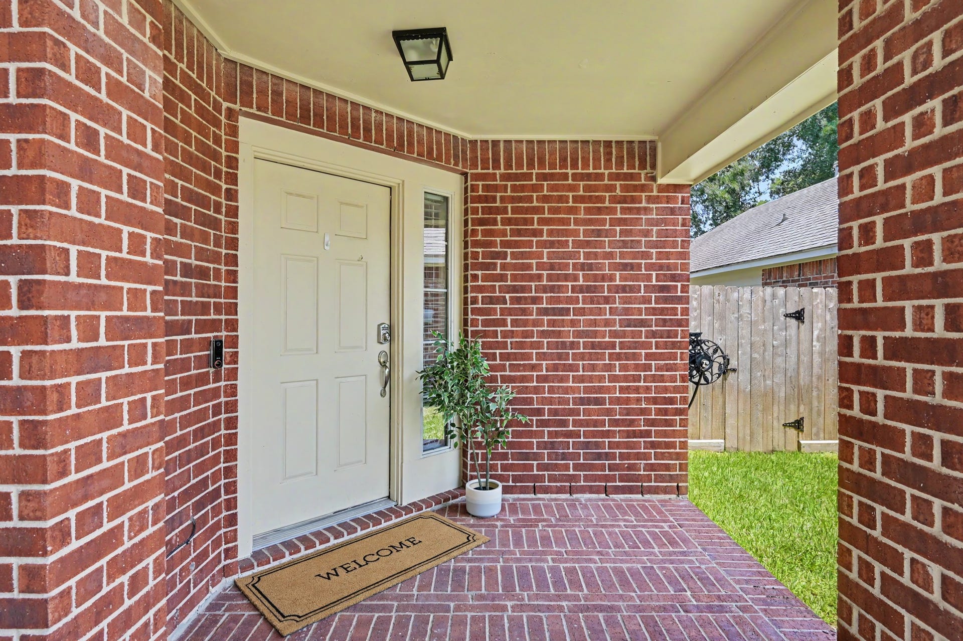 The covered front porch gives packages a dry landing spot and guests a proper welcome. If you're a porch decorator for holidays, this is perfect!