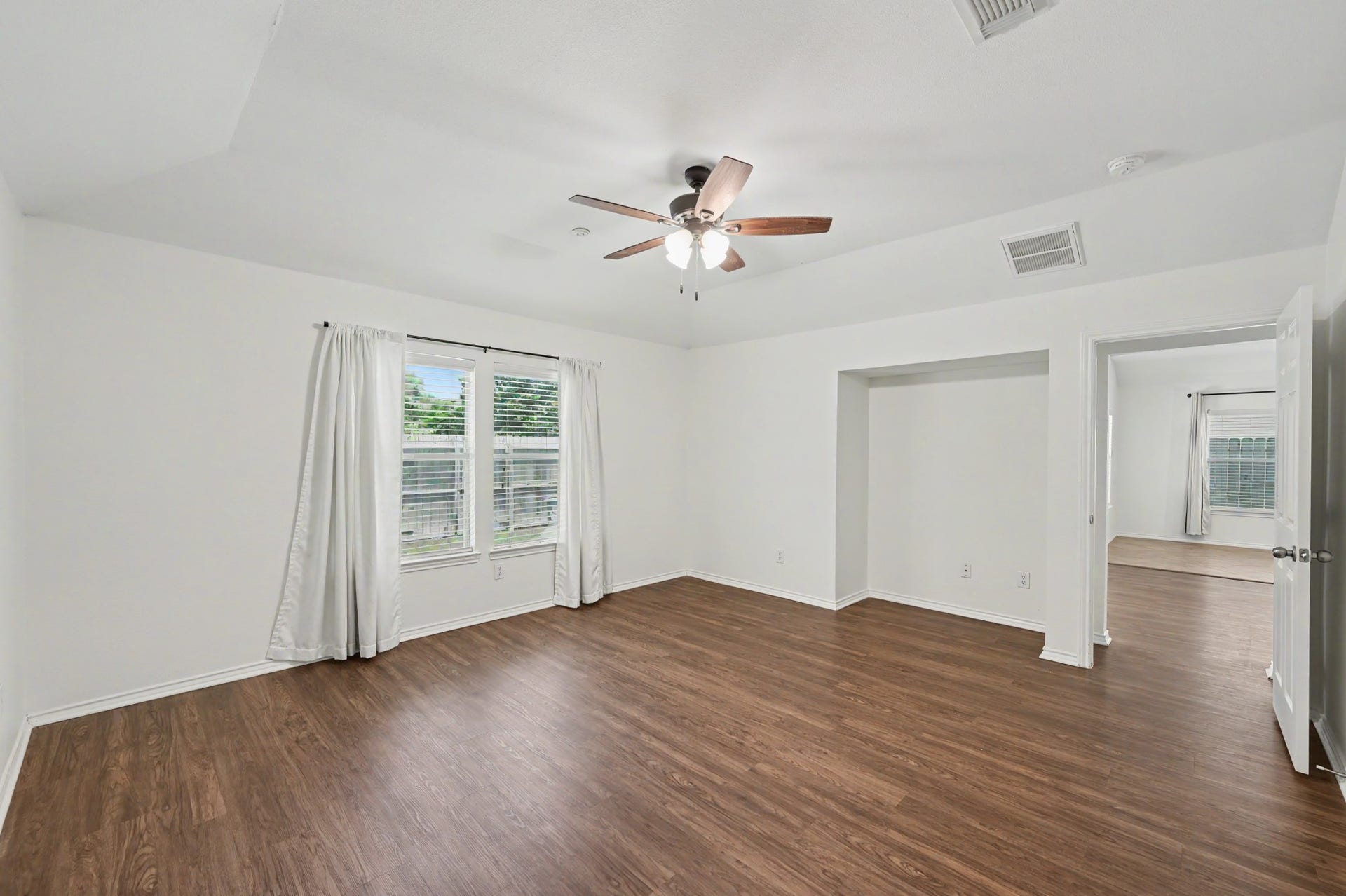 Tucked privately away from the secondary bedrooms, the primary suite offers a spacious retreat at the end of the day with room for even the largest of furniture.