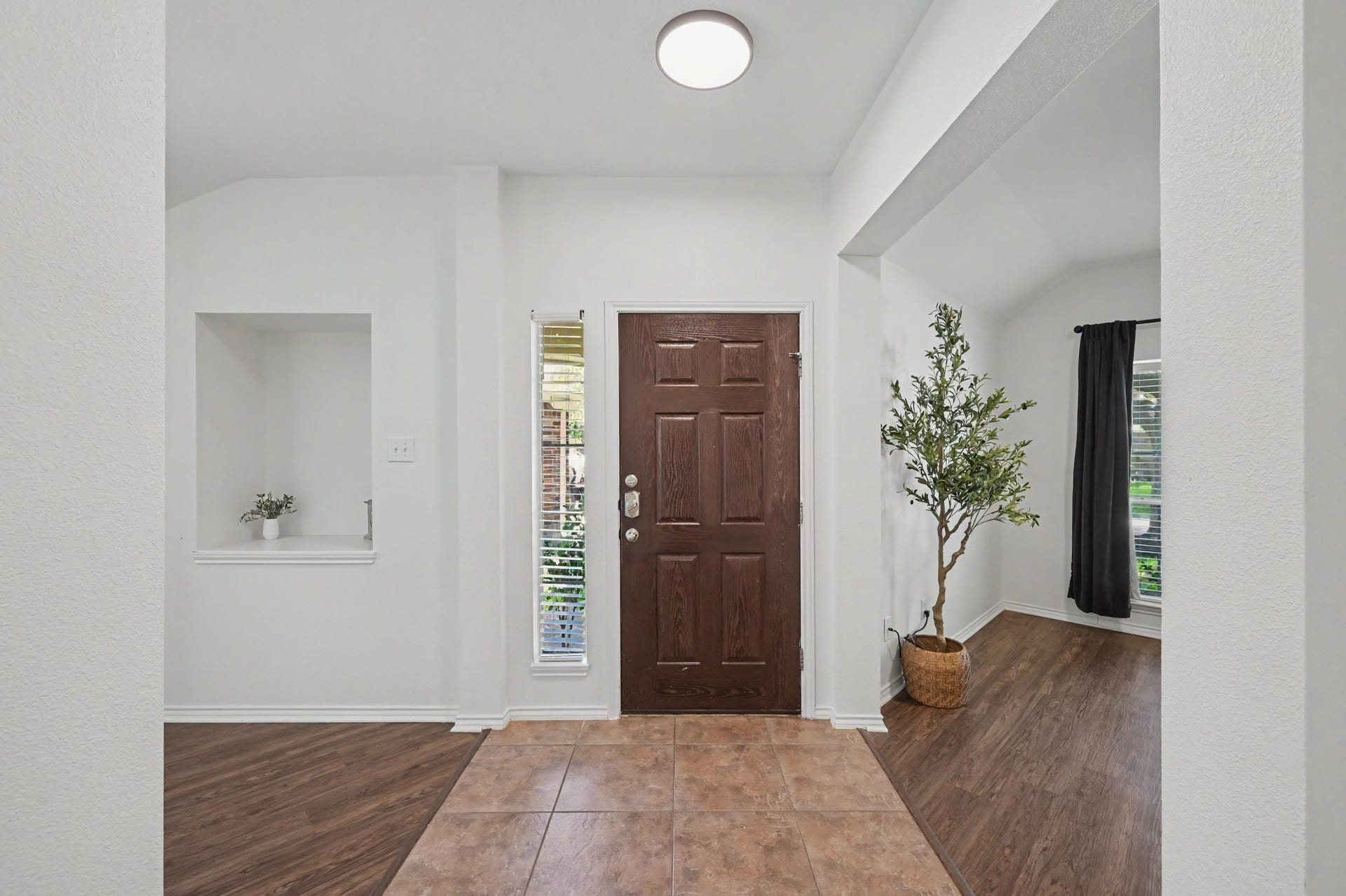 Here's another look at your front door and a peek into your flex space.