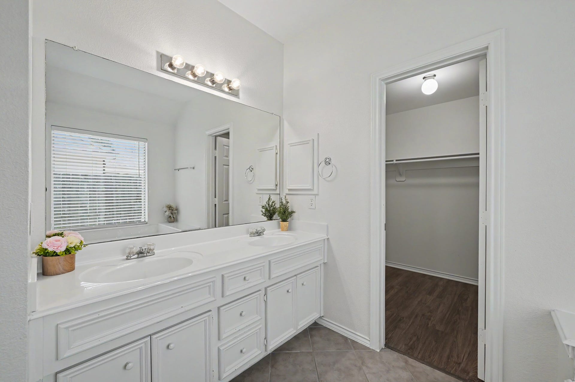 This bathroom has two sinks to give you more counter space and elbow room as you get ready.