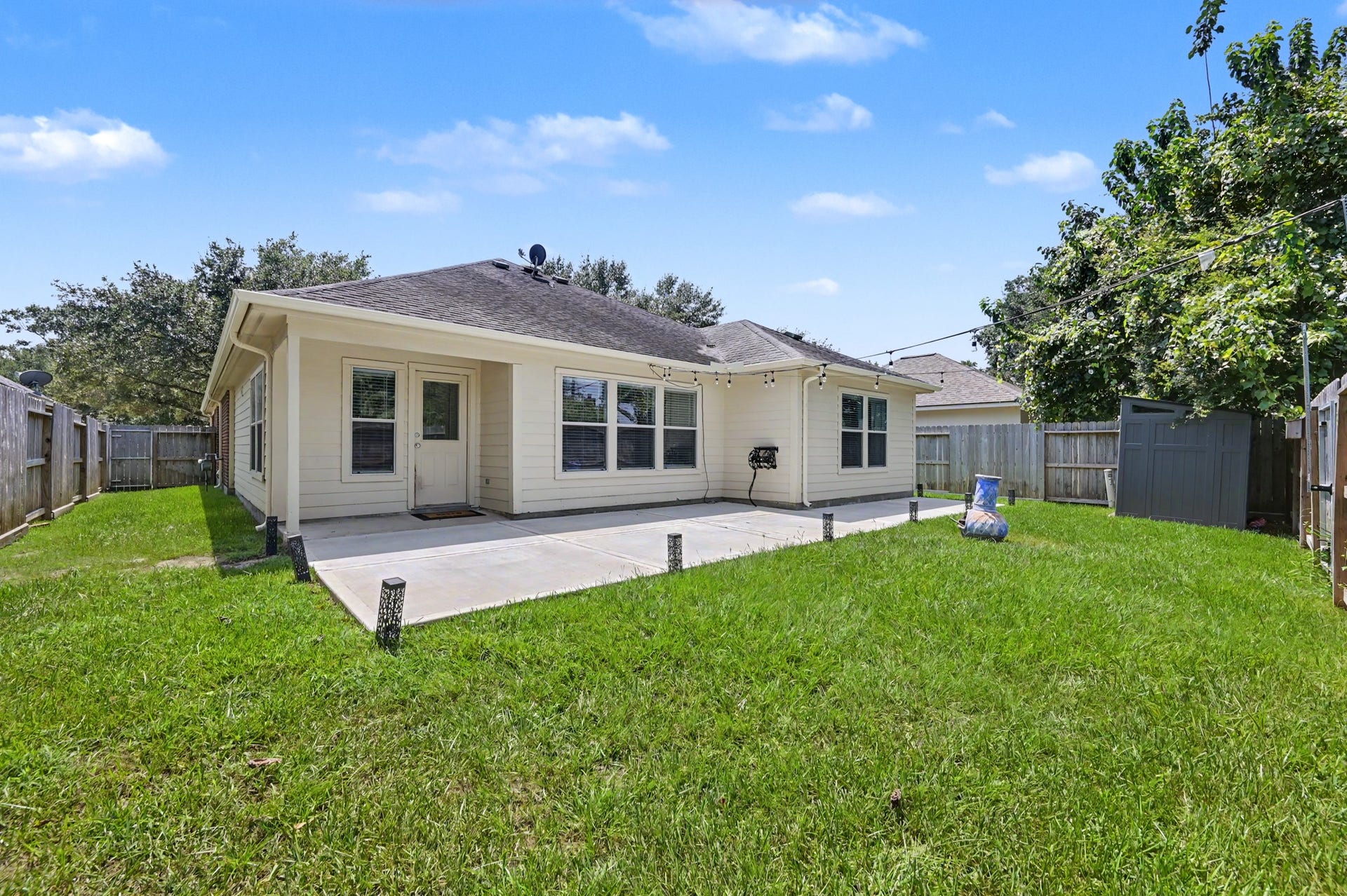 This backyard perfectly combines your desire for entertaining space and room to play.