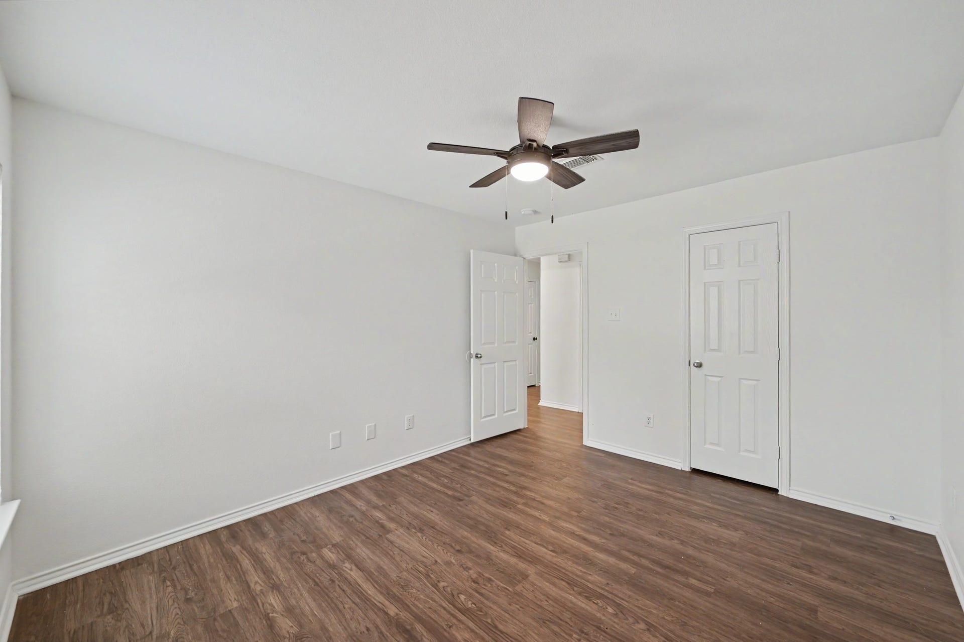 Here is your second secondary bedroom with another great sized closet, easy to maintain floors and neutral paint. Now let's go back down the hallway to the main living area of the home.
