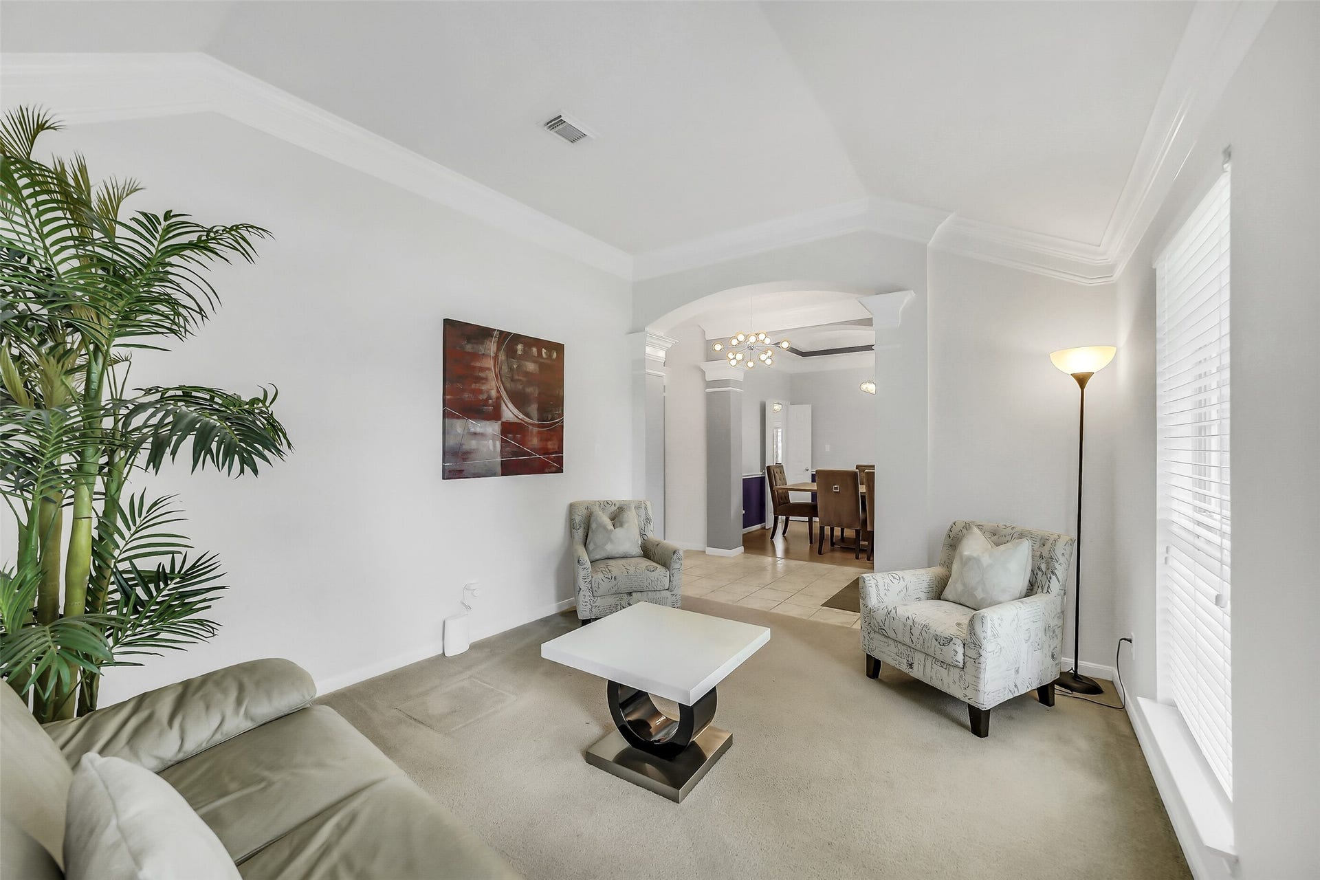 11219 Timbercreek Falls Drive, Houston, TX 77095 The elegant formal living room has abundant natural light, and an inviting archway leading to the dining area.