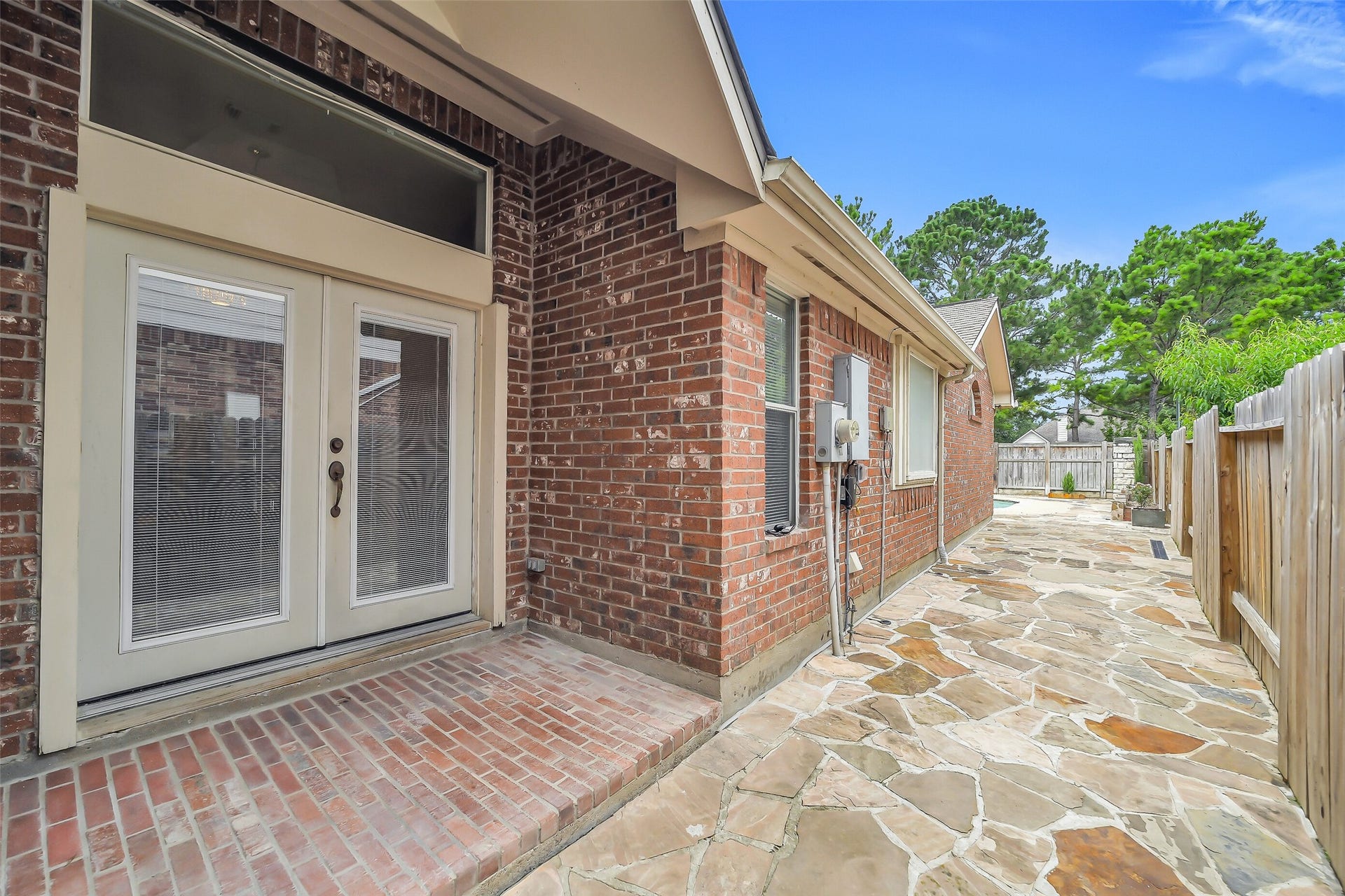 11219 Timbercreek Falls Drive, Houston, TX 77095 This side patio is perfect for your morning coffee.