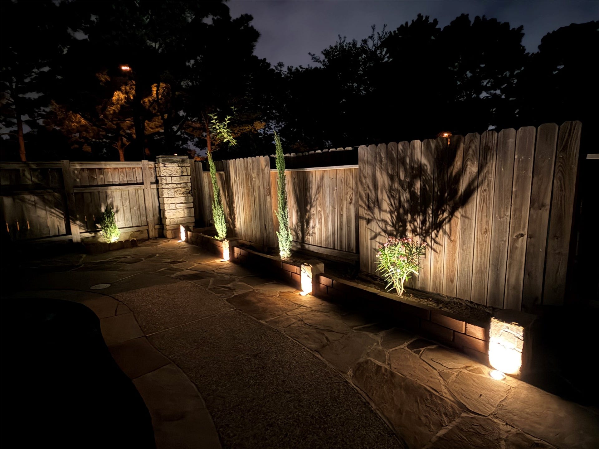 11219 Timbercreek Falls Drive, Houston, TX 77095 Landscape lighting in backyard.