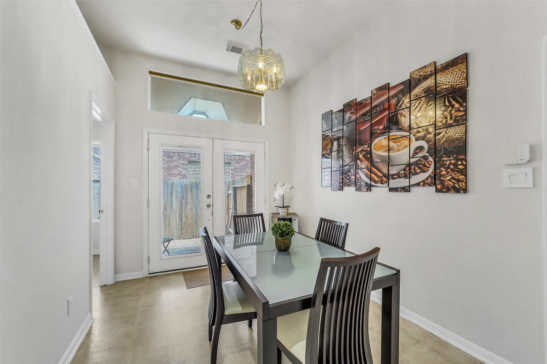 11219 Timbercreek Falls Drive, Houston, TX 77095 Breakfast with glass French doors to a convenient side patio.