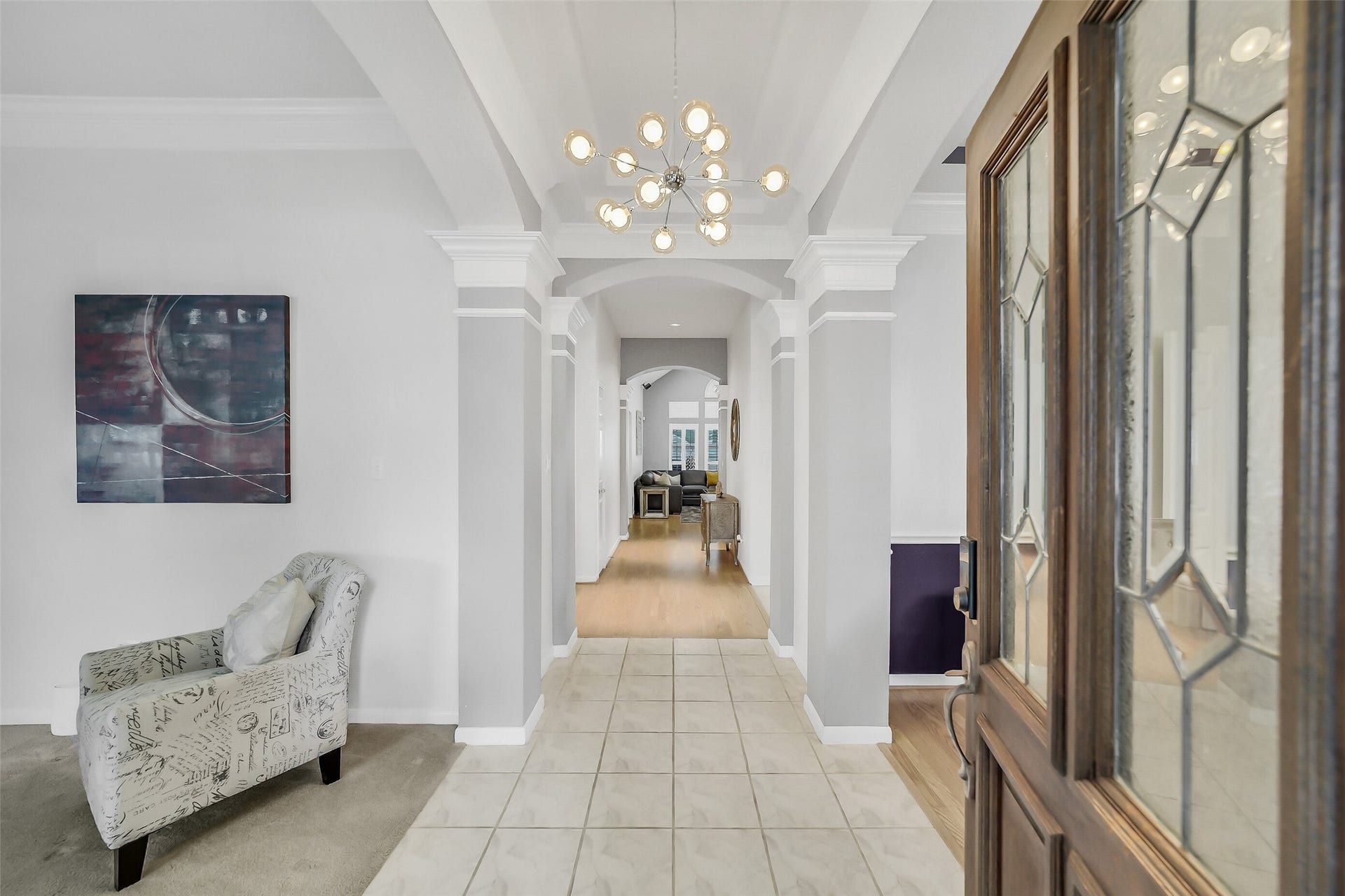 11219 Timbercreek Falls Drive, Houston, TX 77095 The inviting entrance with leaded glass door leads to elegant formal spaces and versatile 3 or 4-bedroom living in this captivating home.