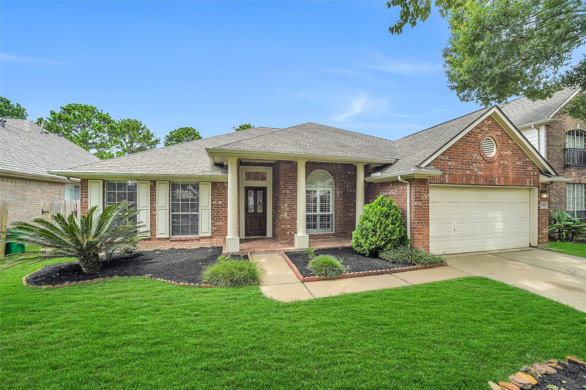 11219 Timbercreek Falls Drive, Houston, TX 77095 The attractive front elevation is complemented by a beautiful covered front porch, inviting you to enjoy its charm and warmth.