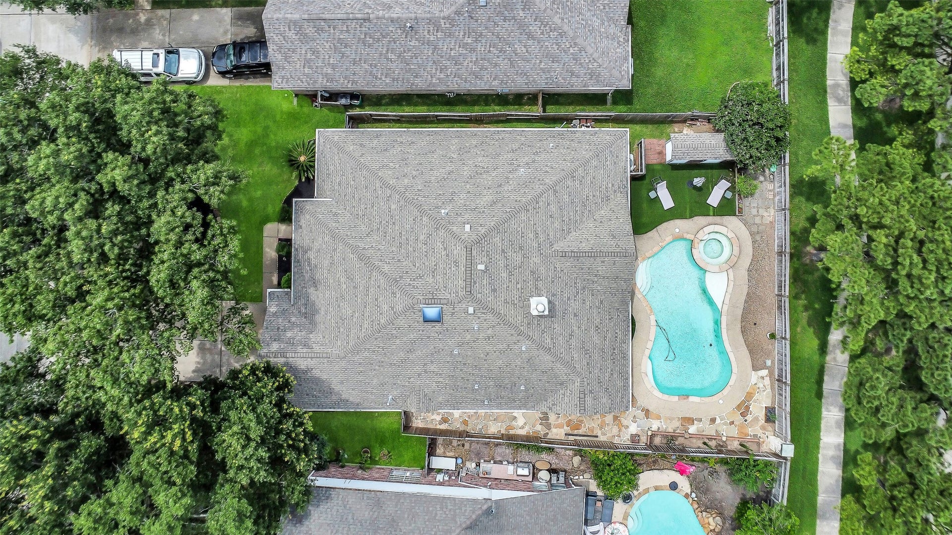11219 Timbercreek Falls Drive, Houston, TX 77095 Backyard oasis with pool and spa.
